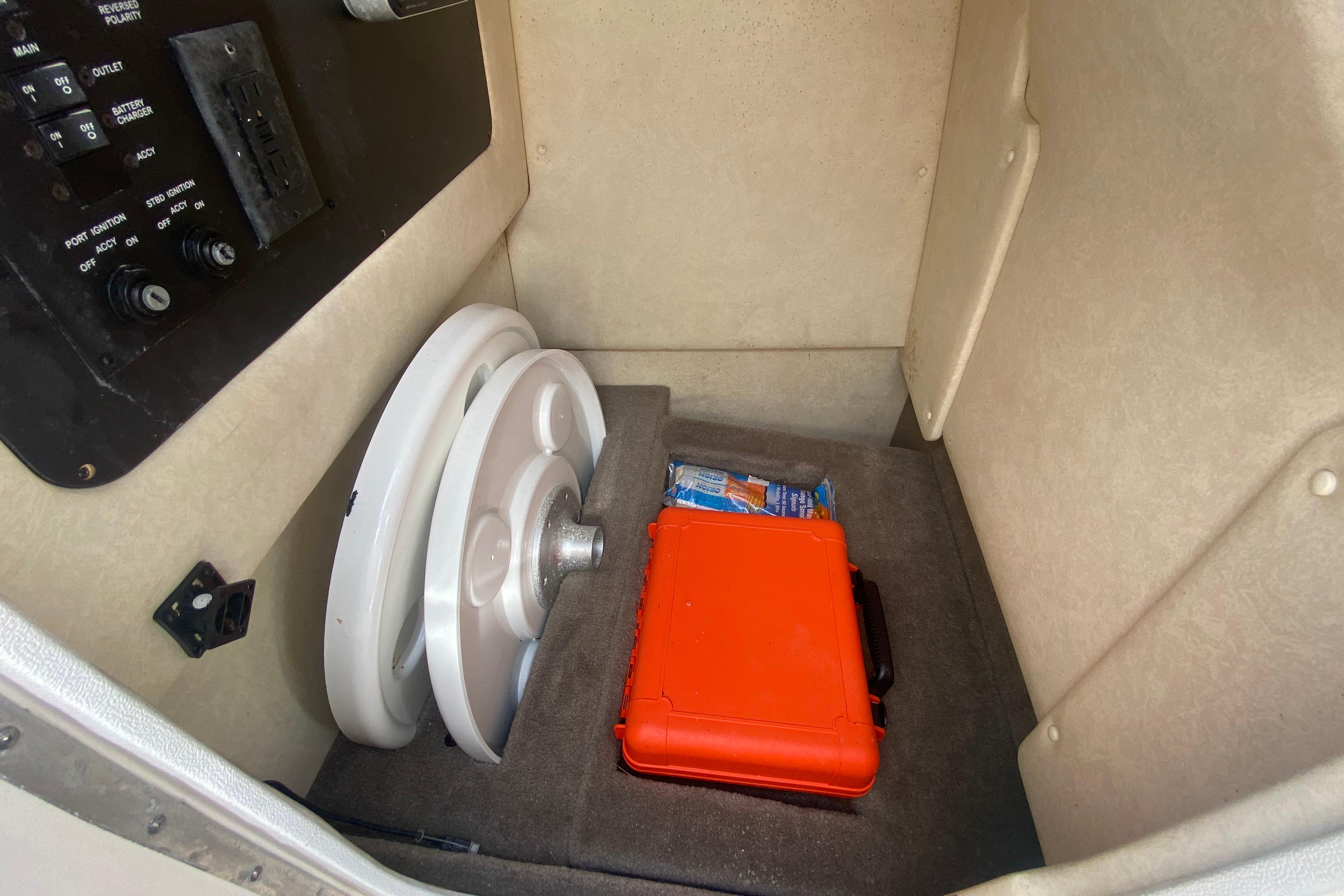 Storage compartment with cockpit and bow tables