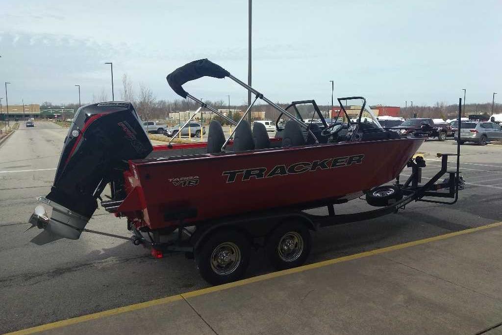 2026 Tracker Targa V-18 WT boat on trailer in parking lot.