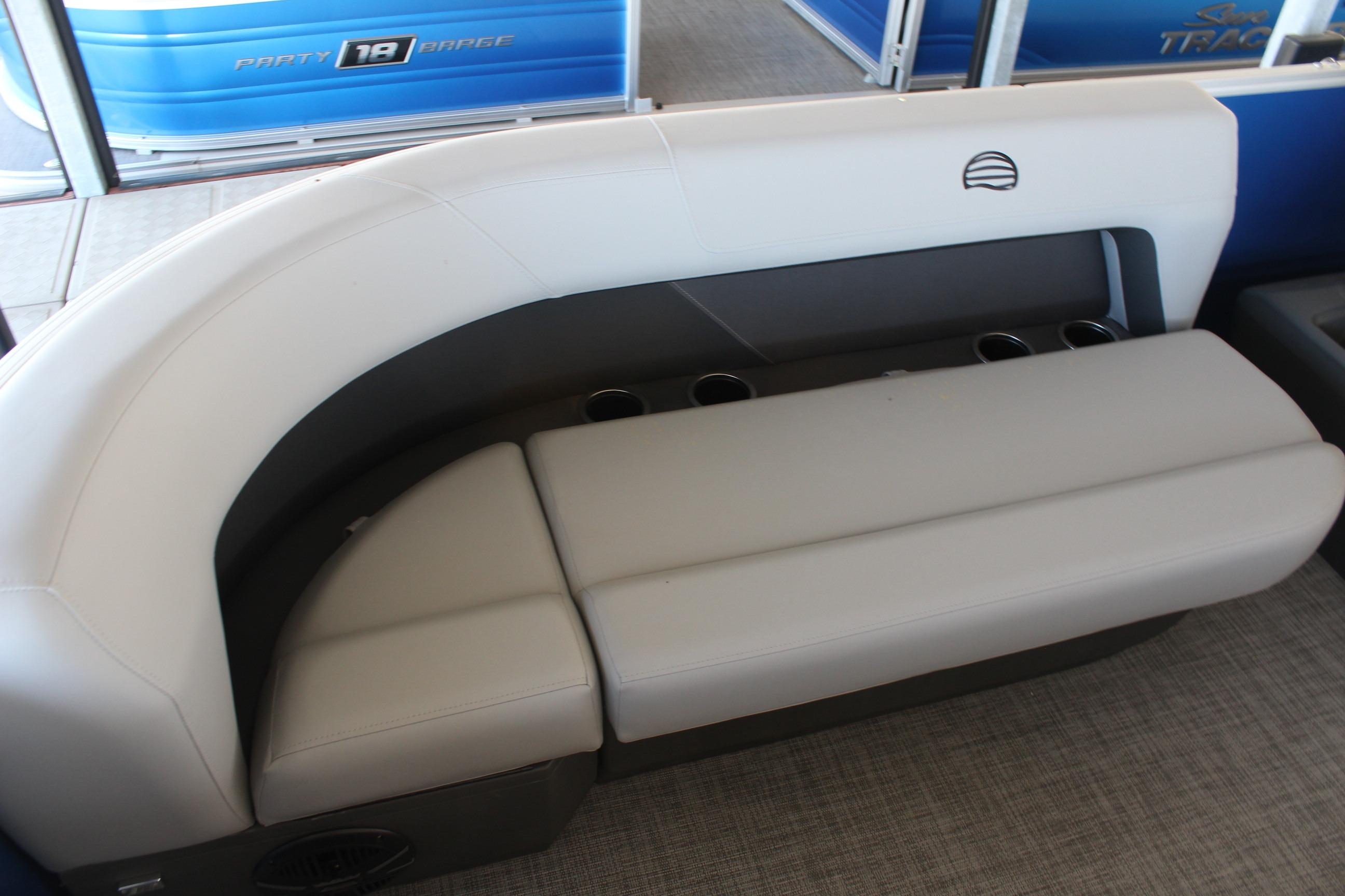 2026 Sun Tracker Party Barge 16 DLX interior seating with cup holders.