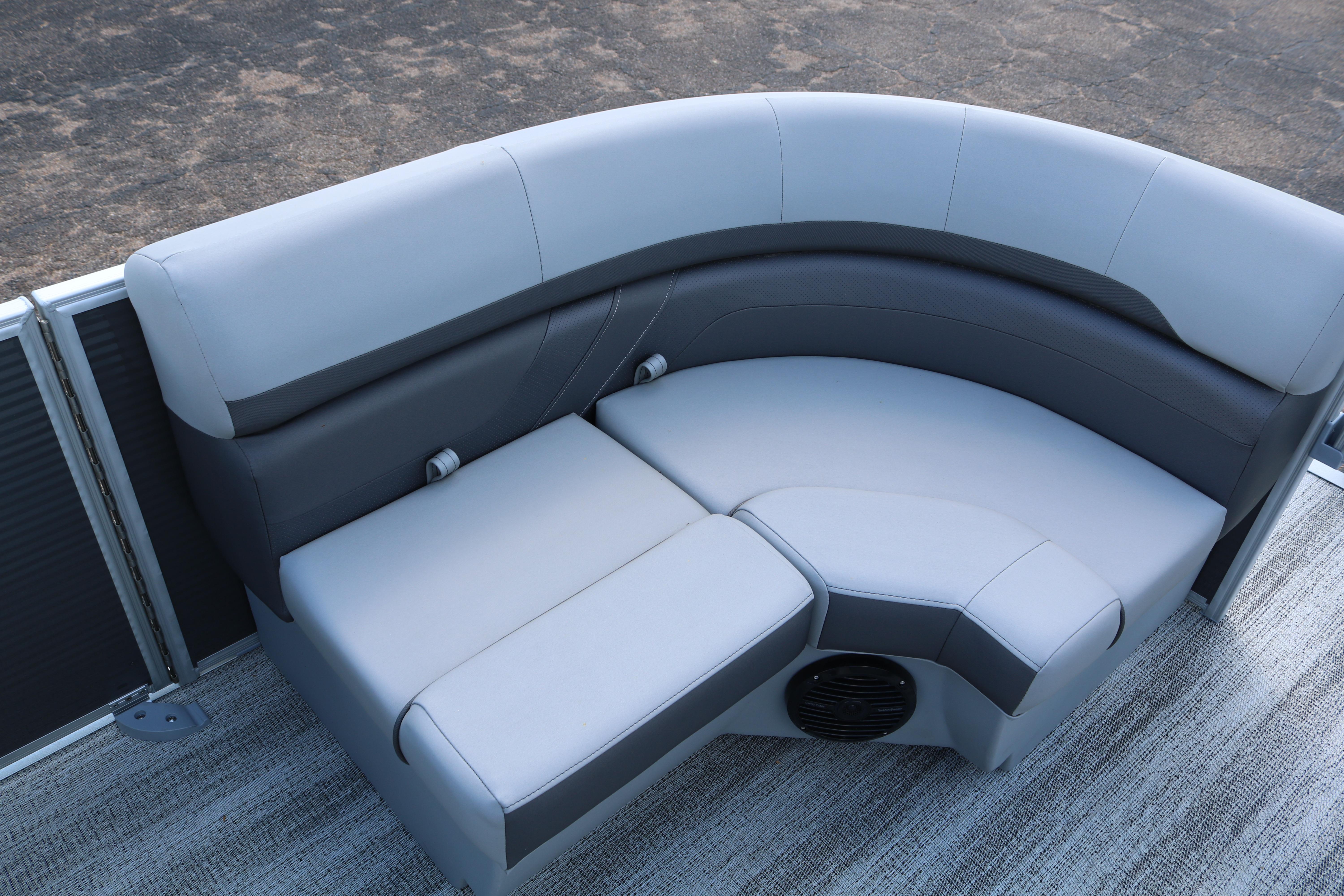 Luxurious seating on 2026 Bennington 20SXSNP REAR FISH pontoon boat, featuring sleek gray upholstery.