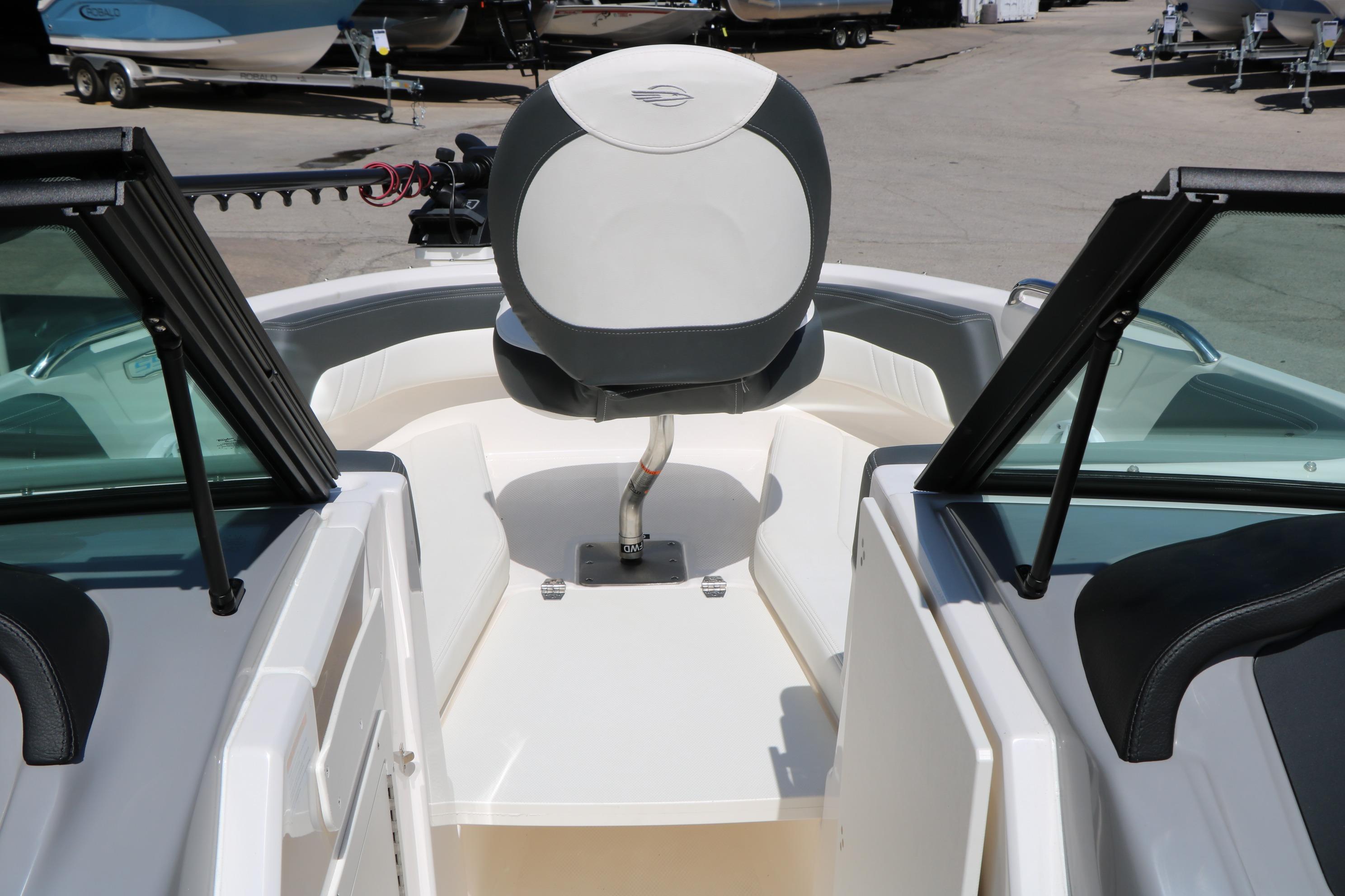 2025 Chaparral 21 SSi Ski & Fish boat interior with swivel seat and windshield.