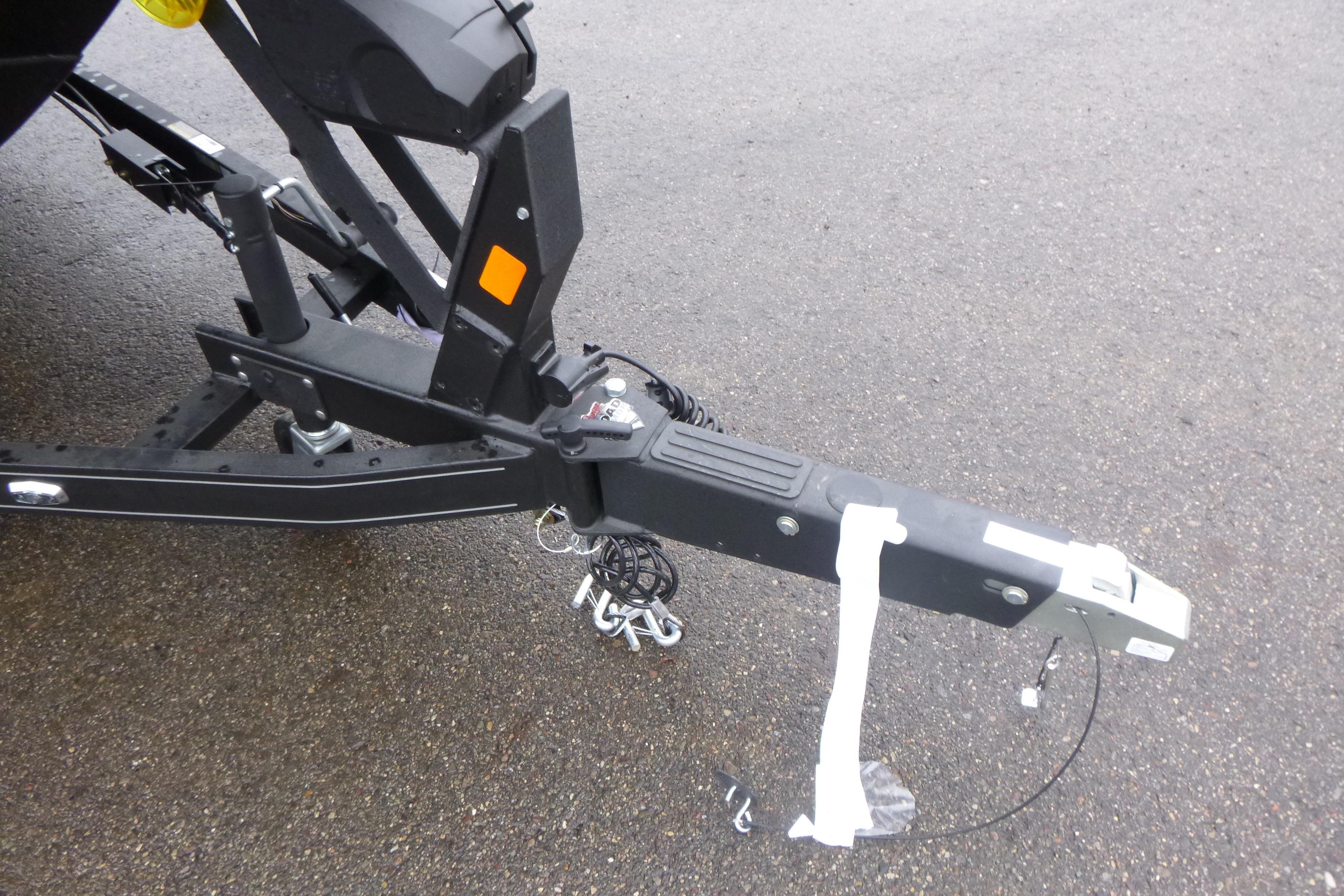 Trailer hitch of 2026 Ranger 620FS Cup Equipped on wet pavement.