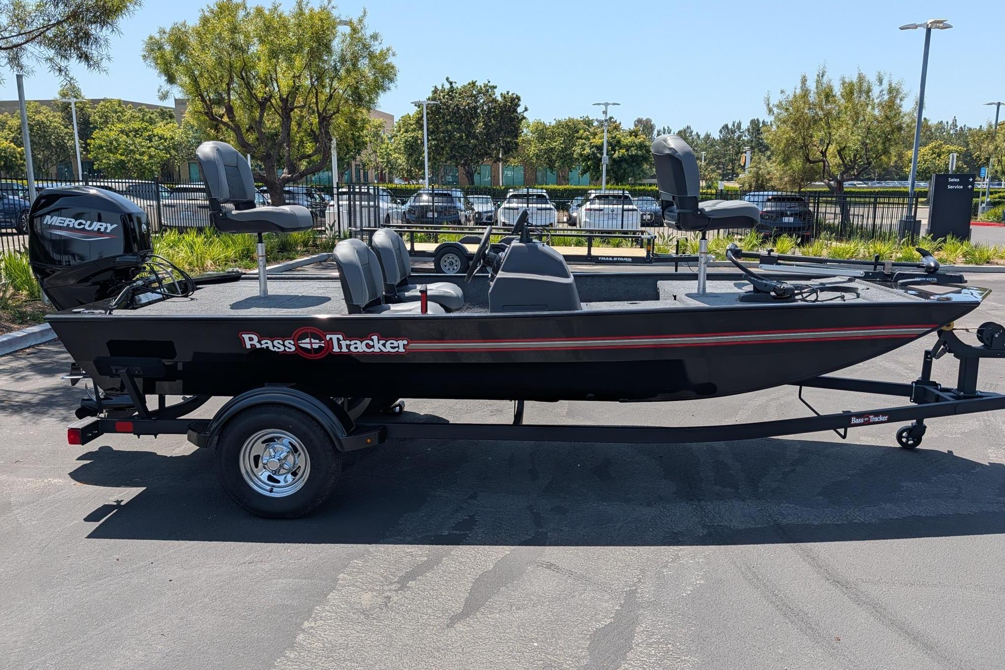 2026 Tracker Bass Tracker Classic XL boat on trailer in parking lot.