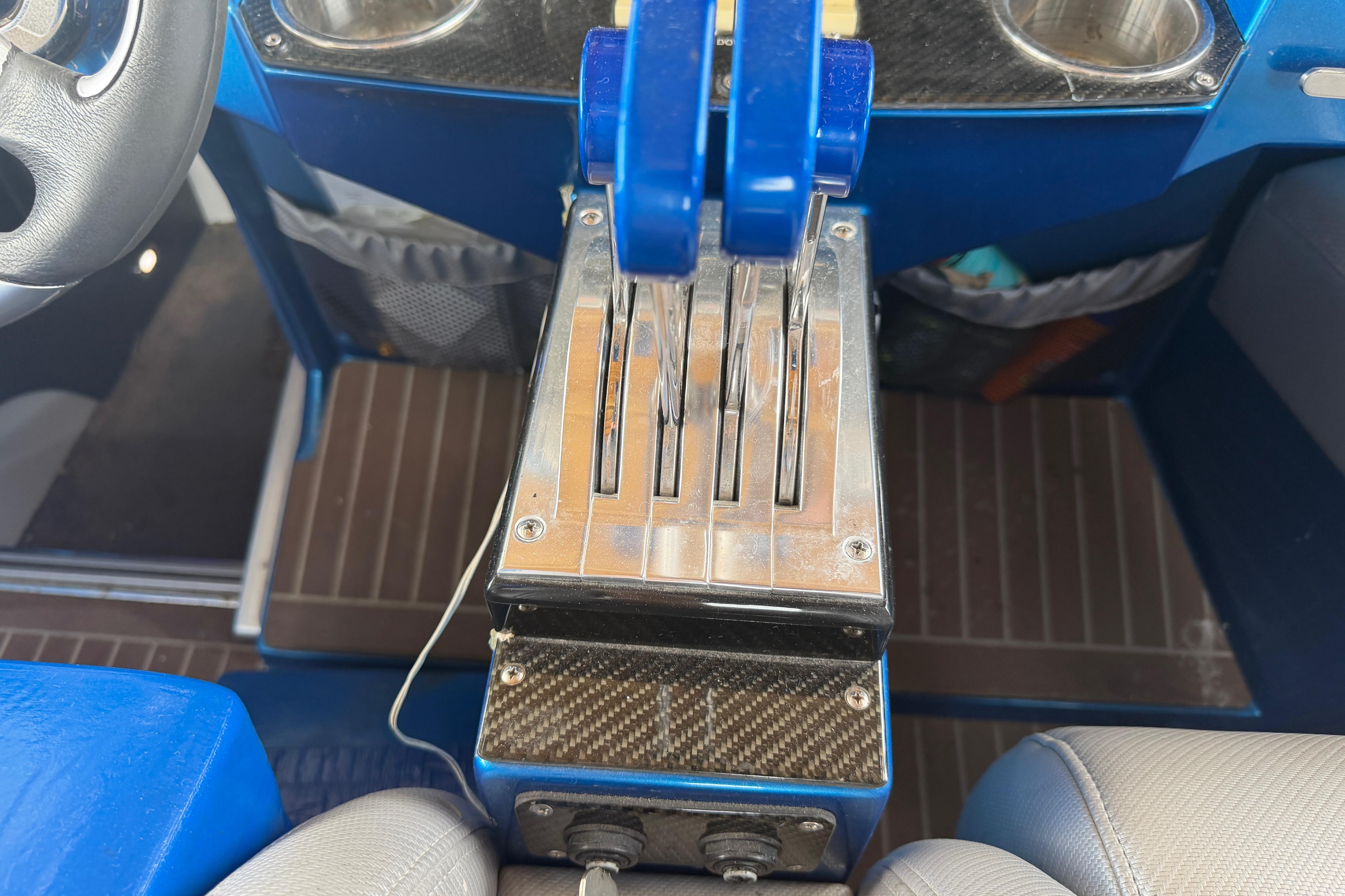 Control panel of a 2013 Nor-Tech 477 SPX Vee Bottom boat with throttle levers.