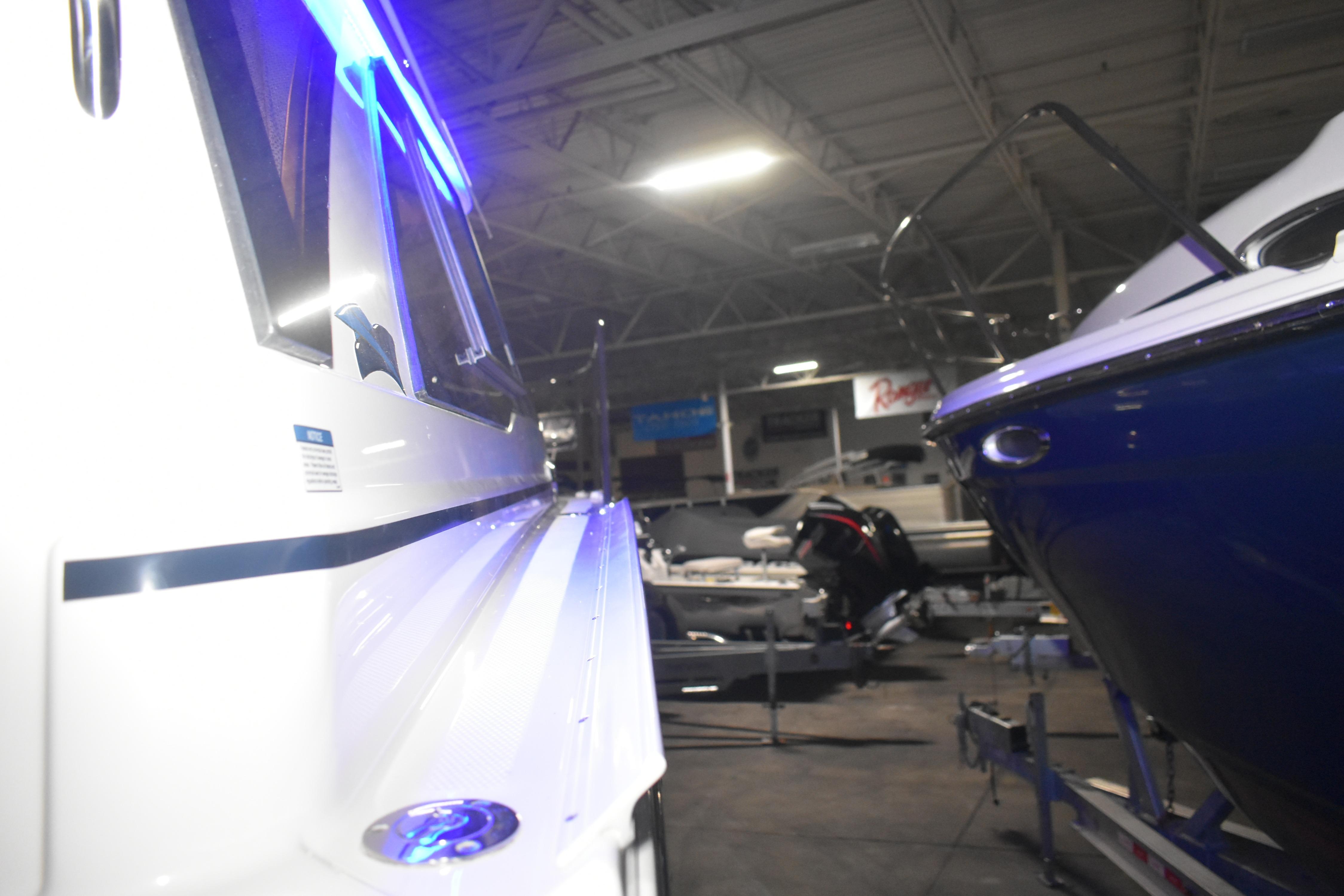 2026 Cutwater C-248 Coupe in a showroom, illuminated by blue lights.