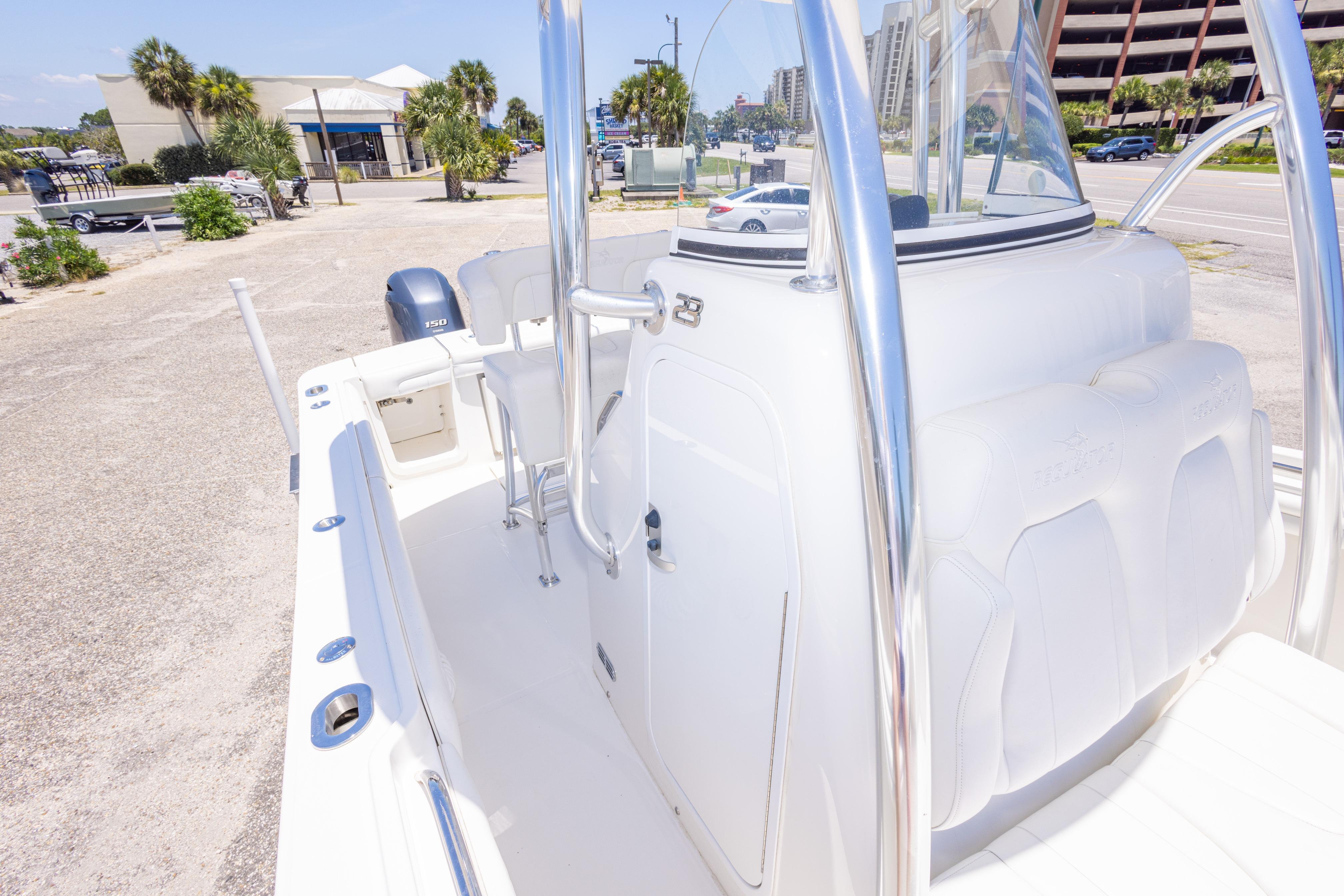 2019 Regulator 23 Center Console boat with seating and console view.
