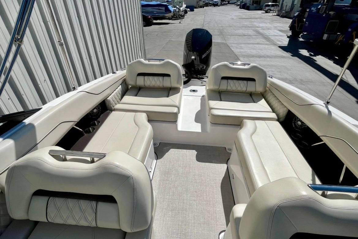 2025 Regal LX2 boat interior with luxurious white seating and spacious layout.