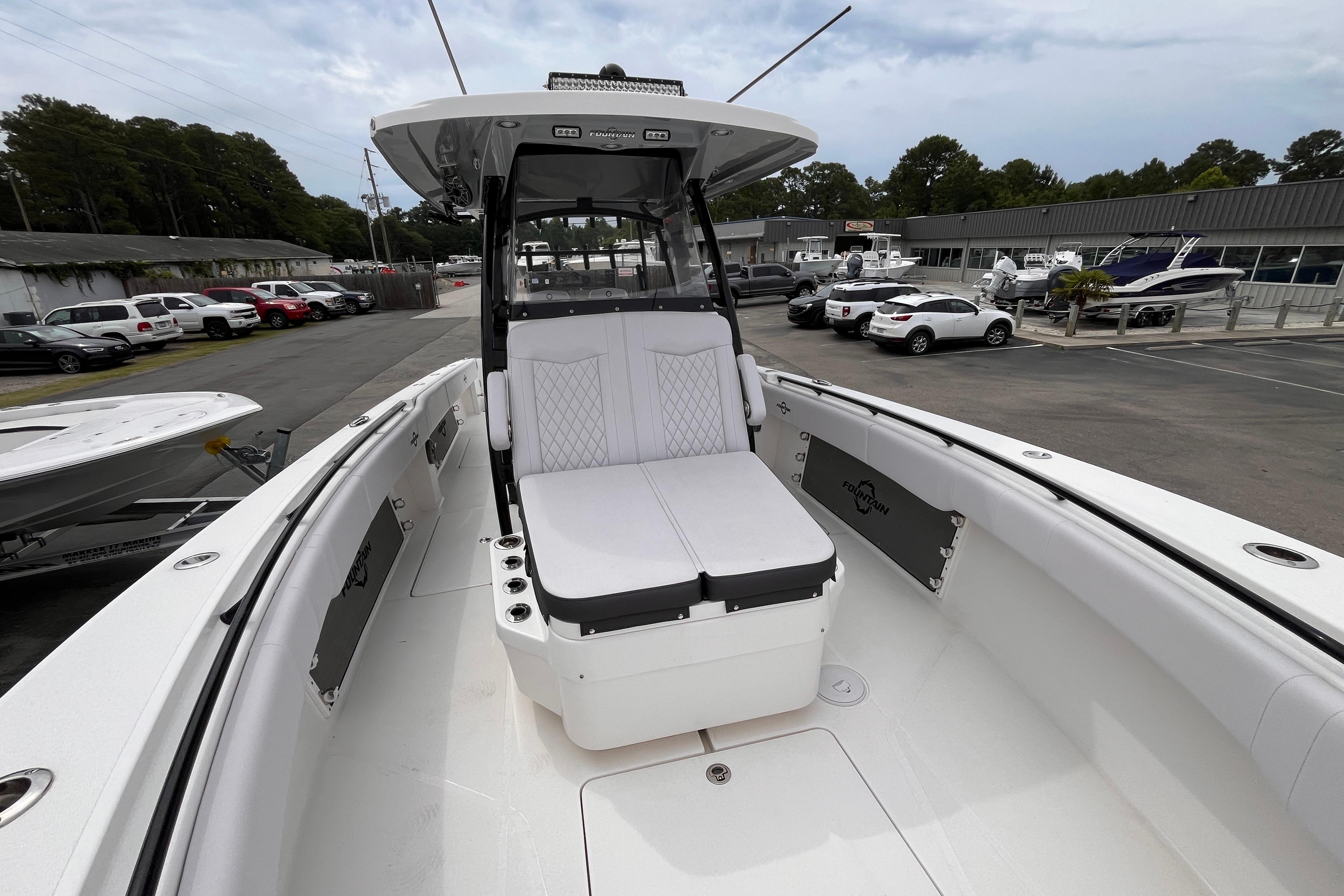 2024 Fountain 34 Tournament Edition boat with spacious seating, docked in a marina.