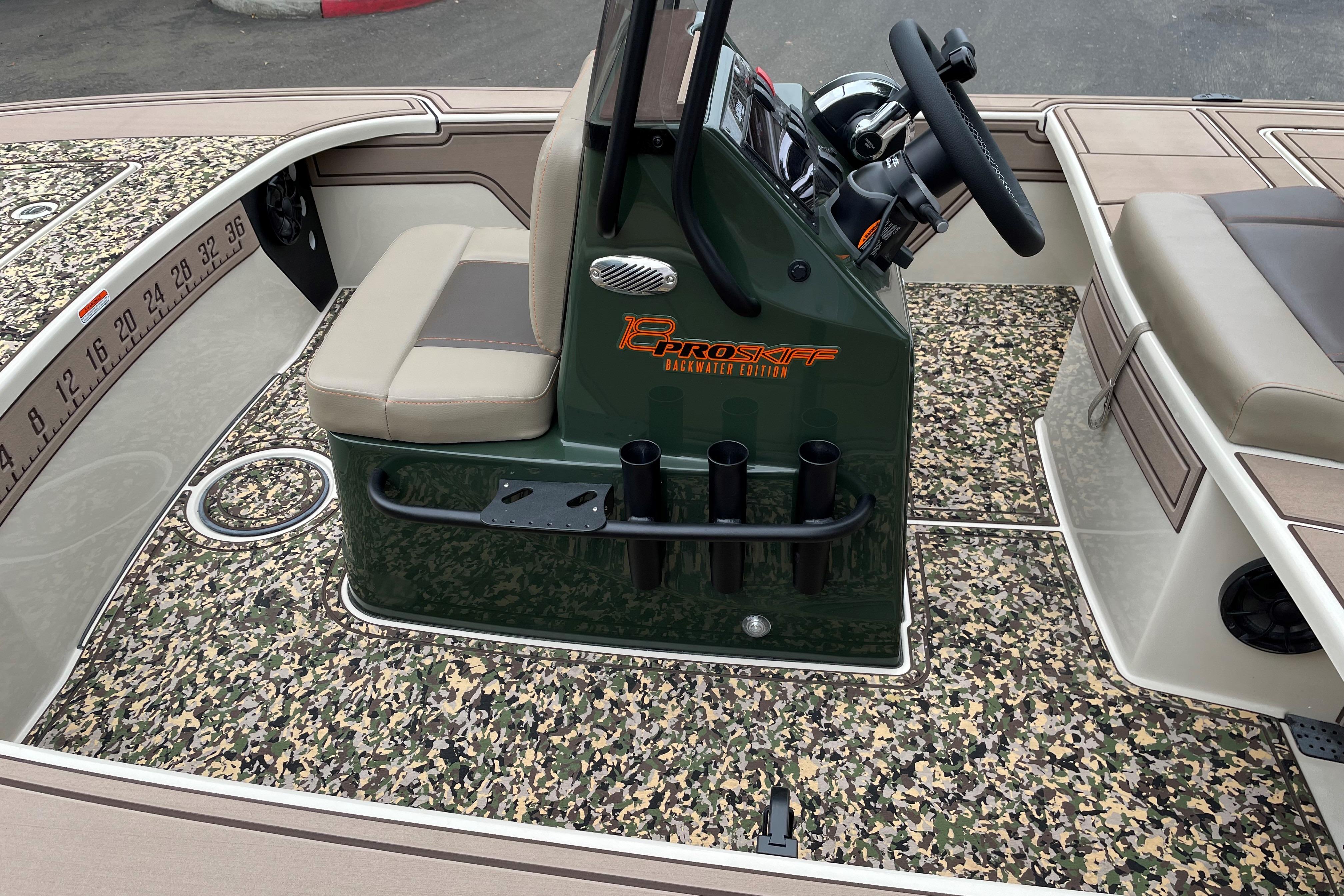 2025 Mako 18 Pro Skiff Backwater Edition with camo flooring and central console.