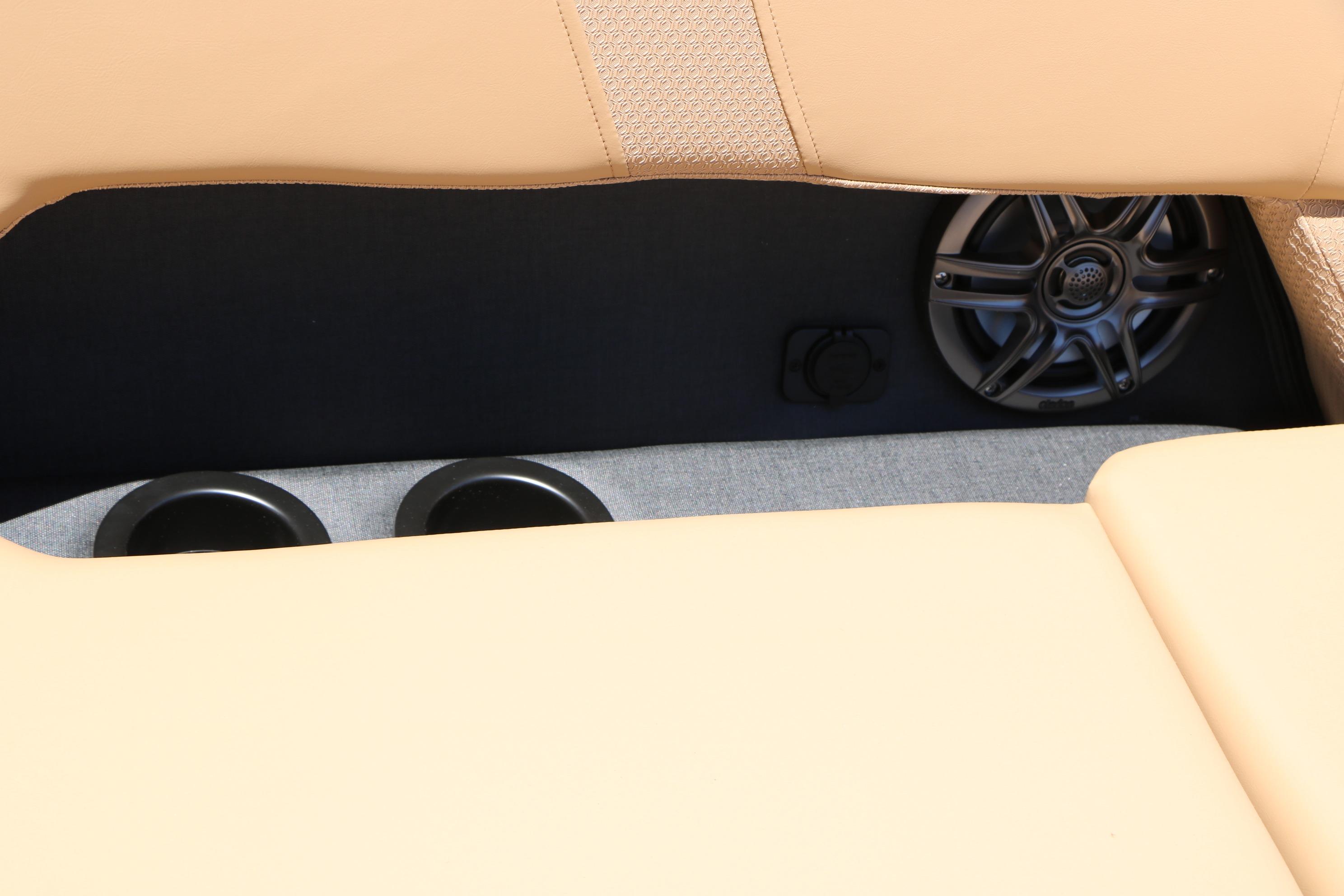 Rear seat speaker and cup holders in 2026 Evotti 521CS interior.