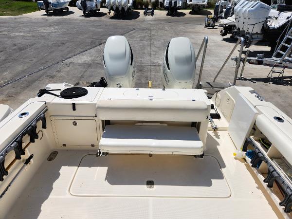 2005 Pursuit 3070 Offshore Center Console boat with dual engines and spacious deck layout.