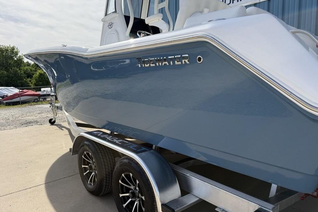 2026 Tidewater 232 LXF boat on trailer, showcasing sleek blue hull design.
