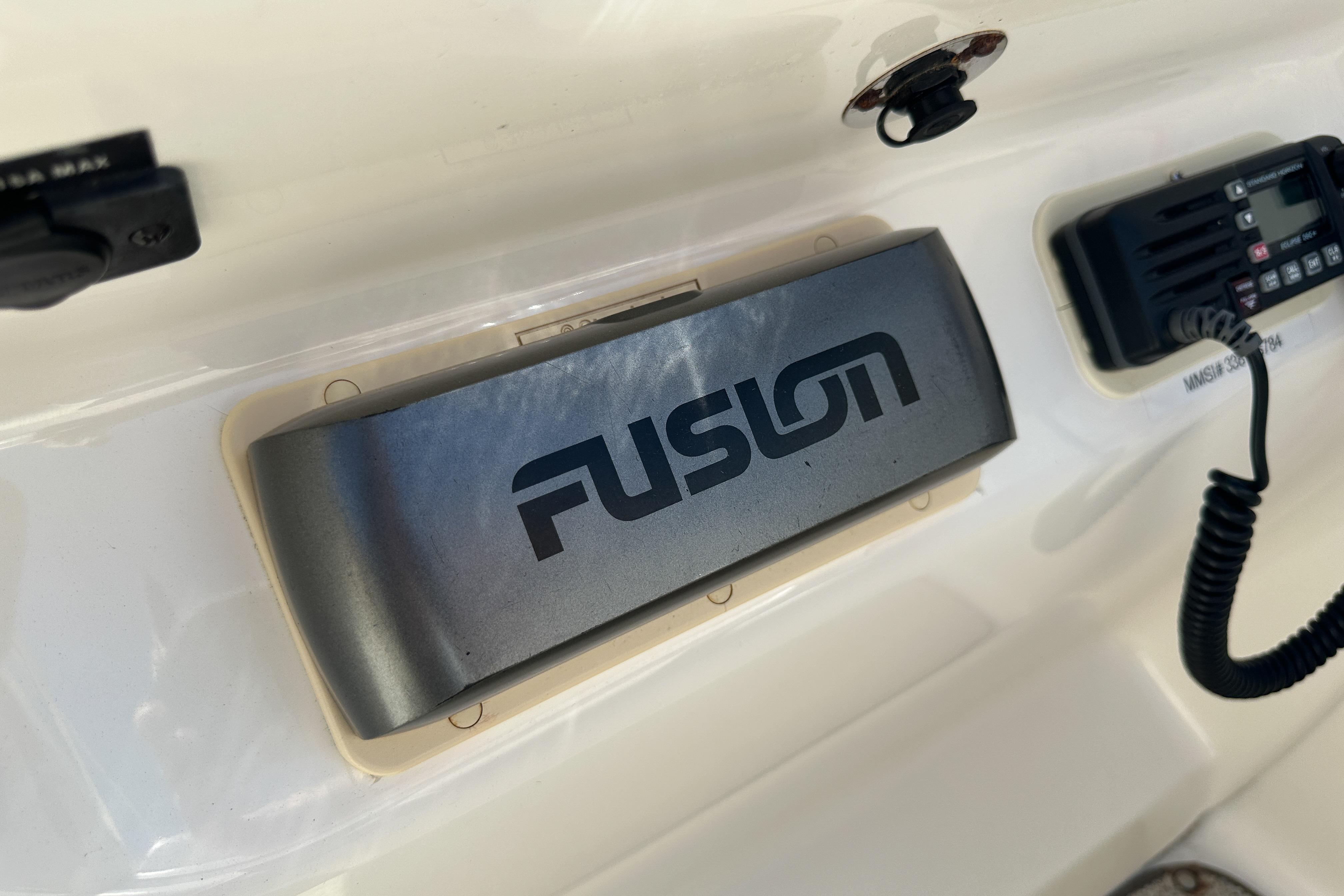 Fusion audio system on 1998 Sea Ray 215 Express Cruiser dashboard.