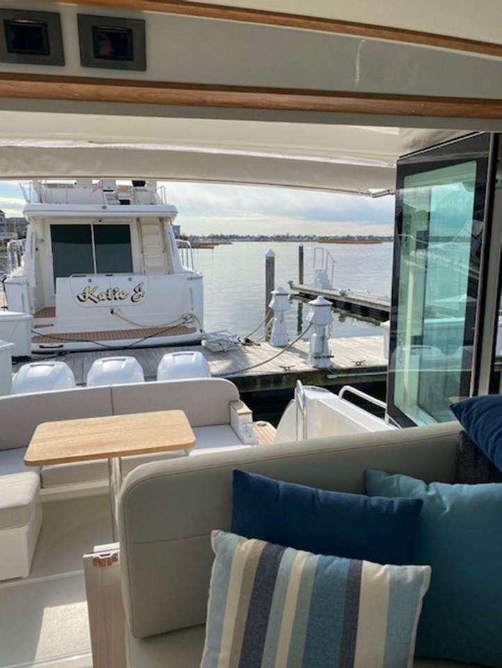 Back Cove 39O 2025 model yacht interior with dock view.