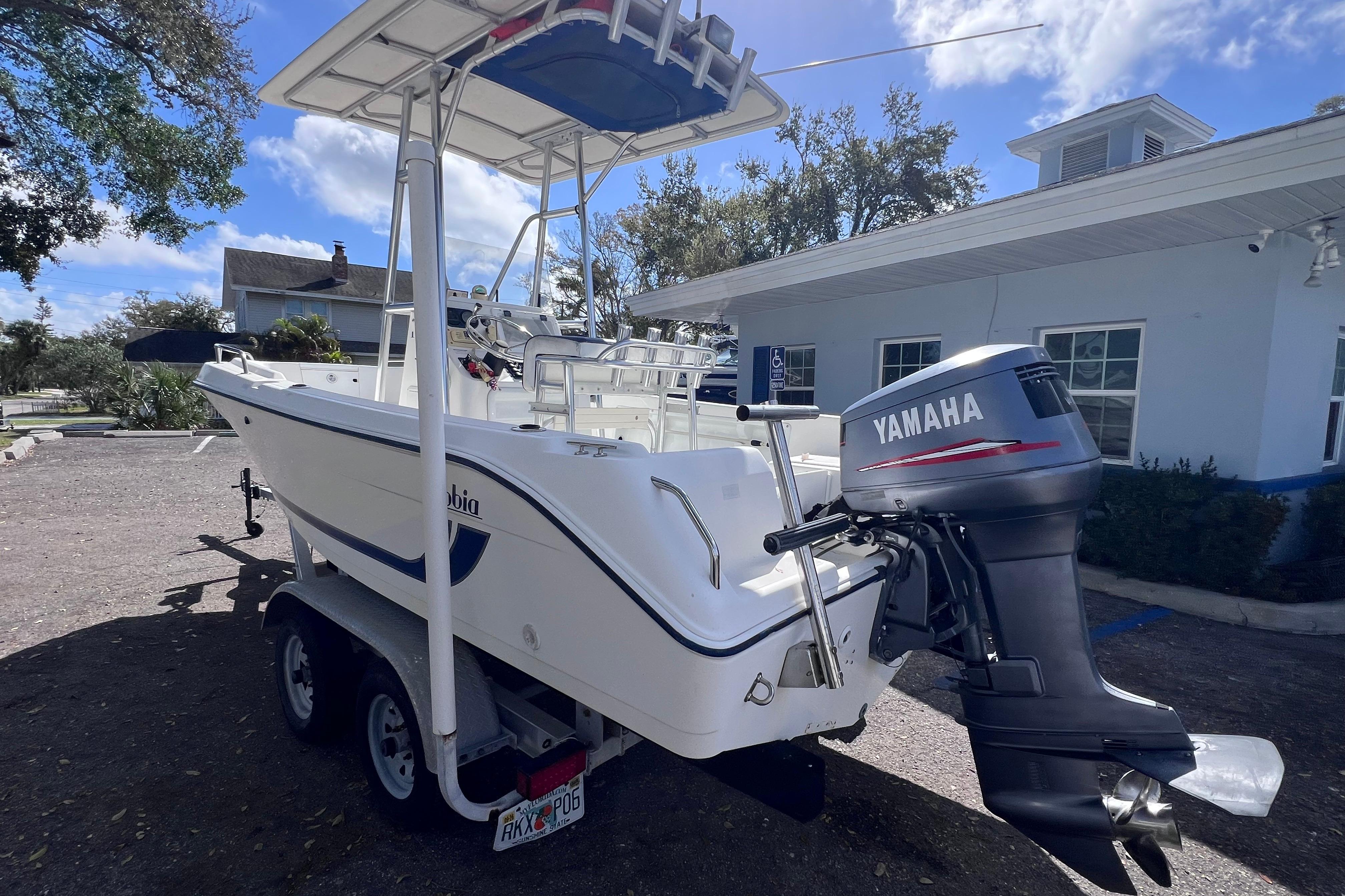 2001 Cobia 194 Center Console boat with Yamaha outboard motor on trailer.