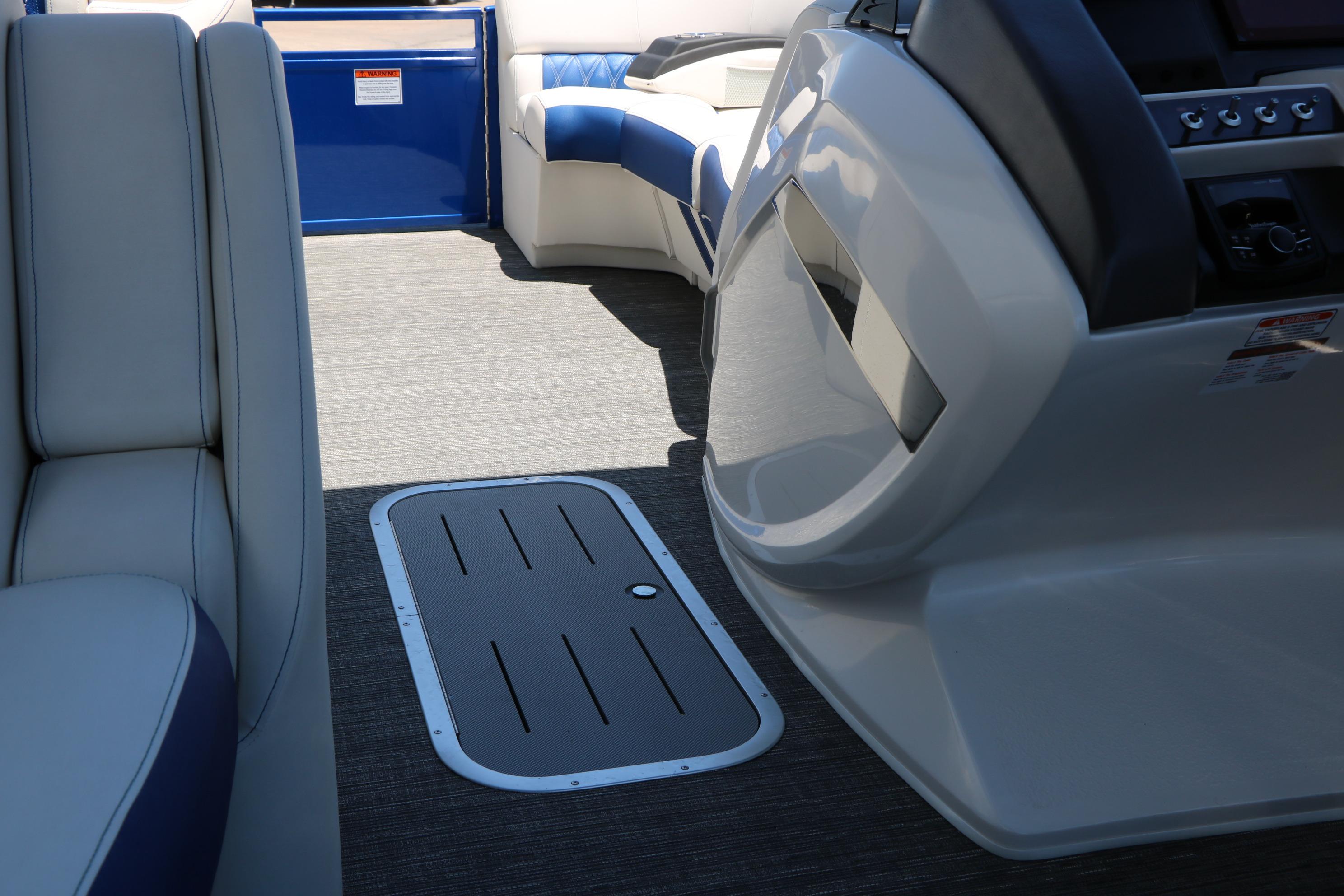 2024 Bennington 23 RX Swingback interior with sleek seating and modern dashboard design.