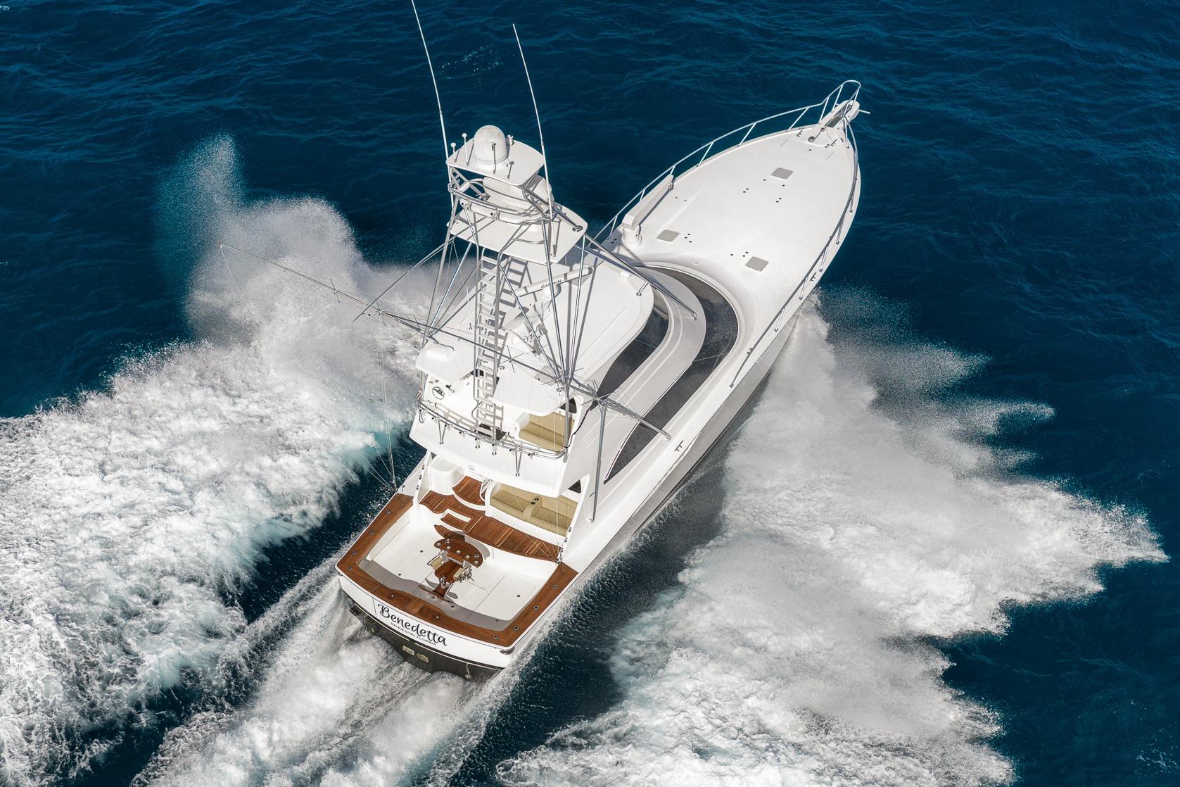 2012 Viking 70 Enclosed Bridge yacht cruising on open ocean waters.