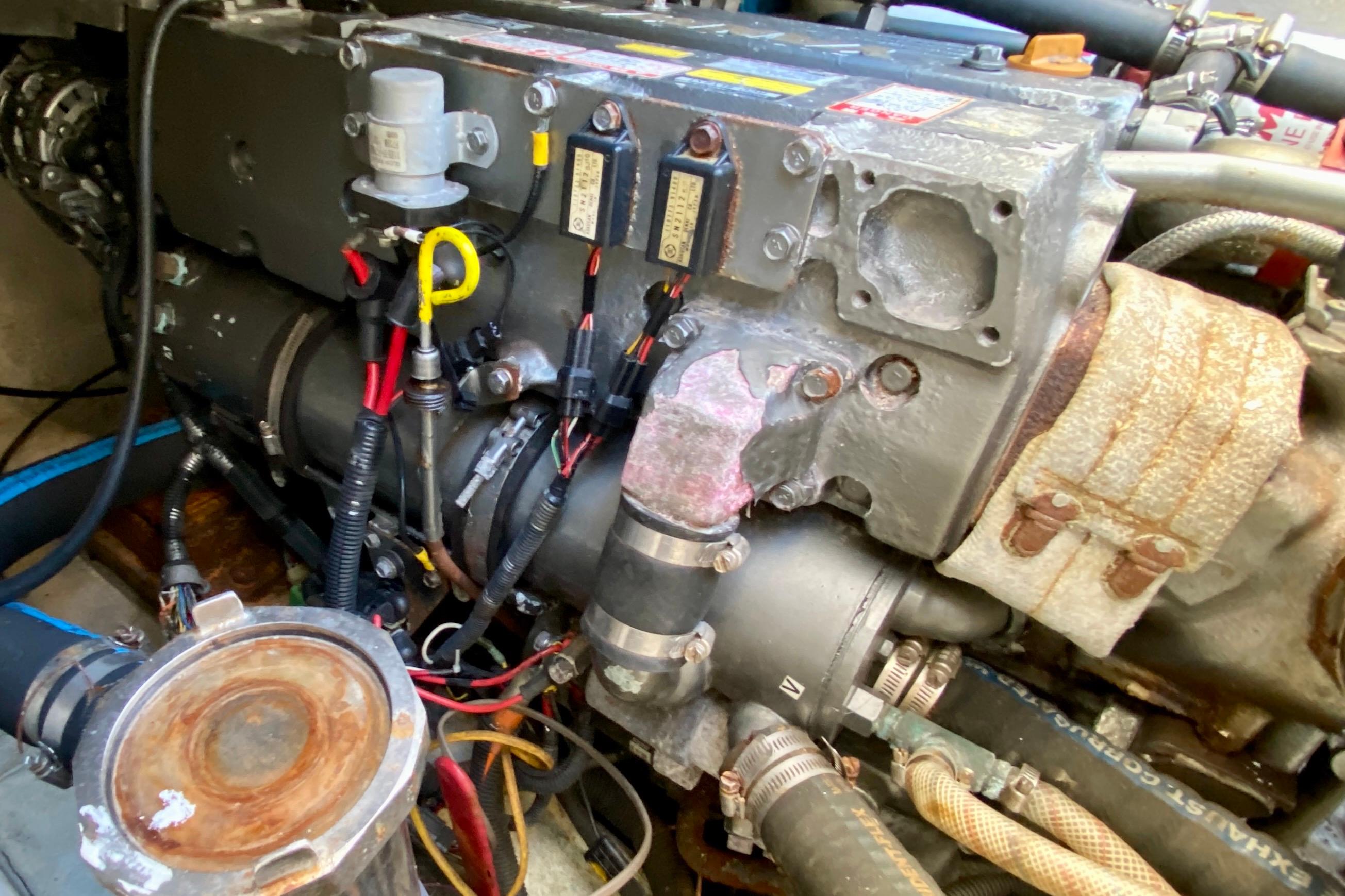 Engine compartment of a 2001 SportsCat 44, showcasing detailed mechanical components and wiring.