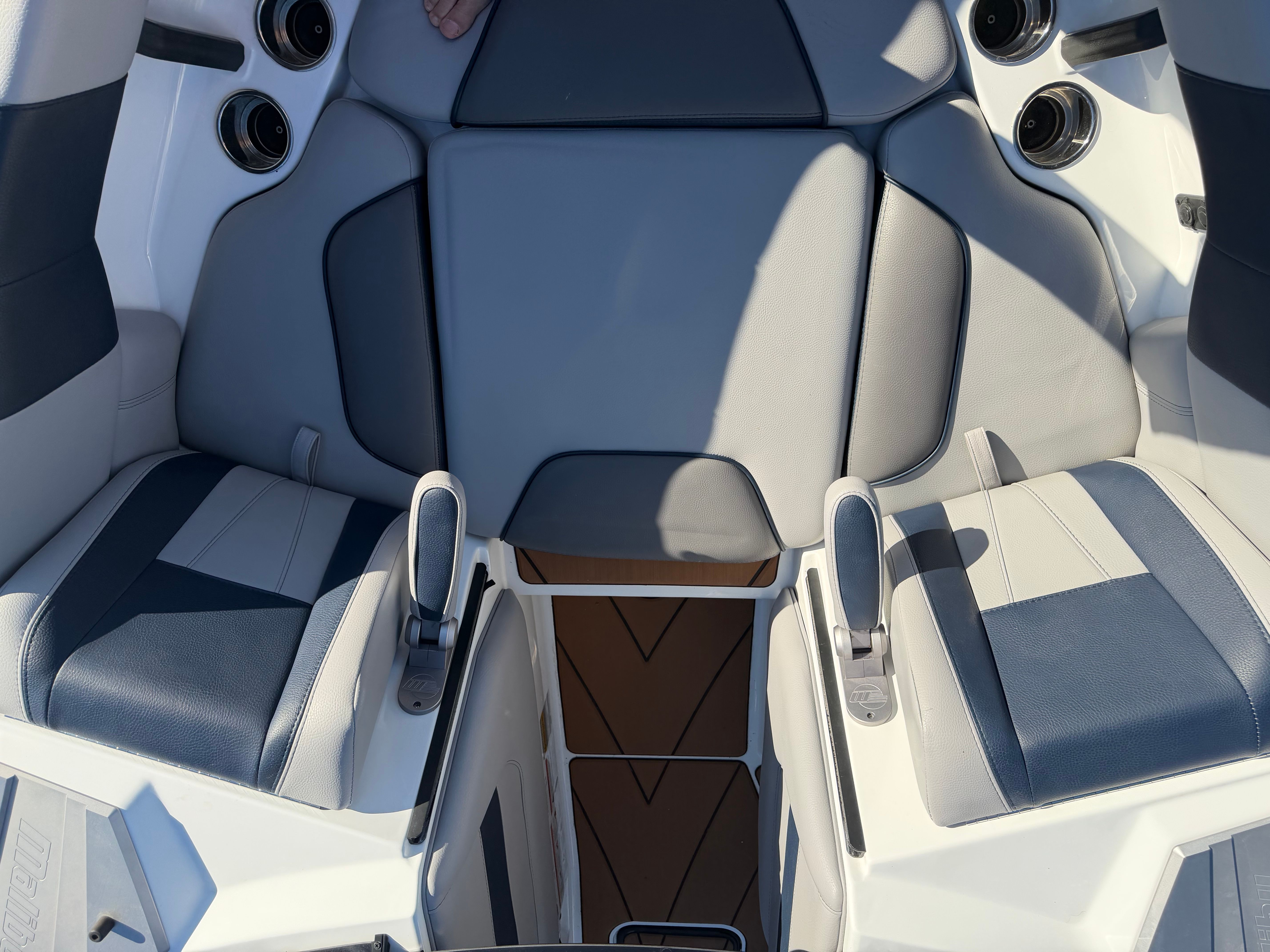 Interior of a 2021 Malibu Wakesetter 23 LSV with gray and blue seating.
