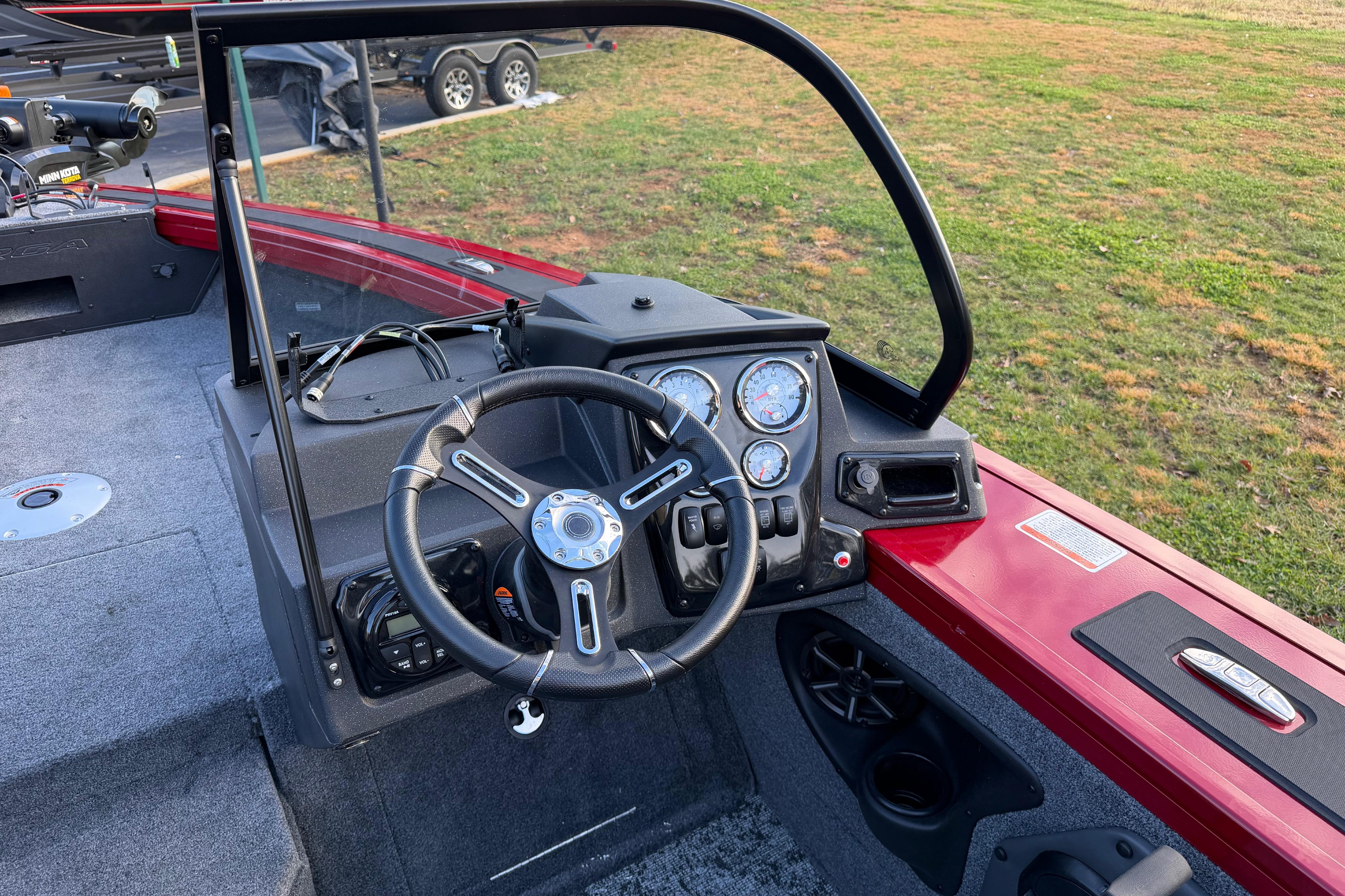 2026 Tracker Targa V-19 Combo boat dashboard with steering wheel and gauges.