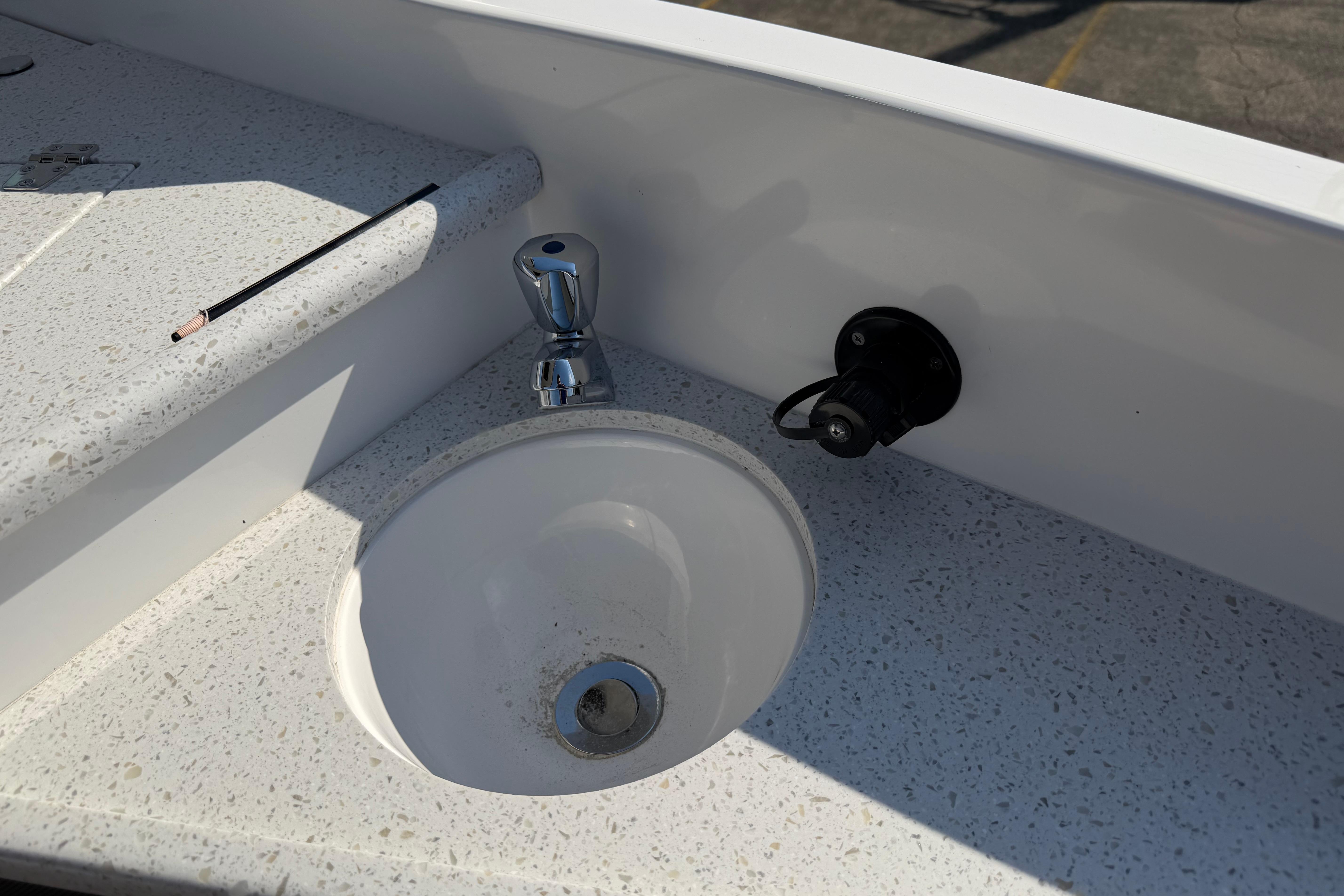 2019 Rinker EX 320 boat sink with faucet and countertop detail.