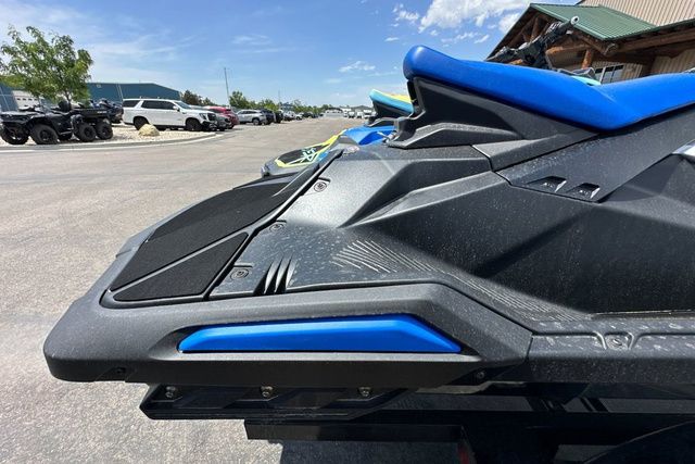 Close-up of a black Yamaha WaveRunner Jetblaster with blue accents in a parking lot.