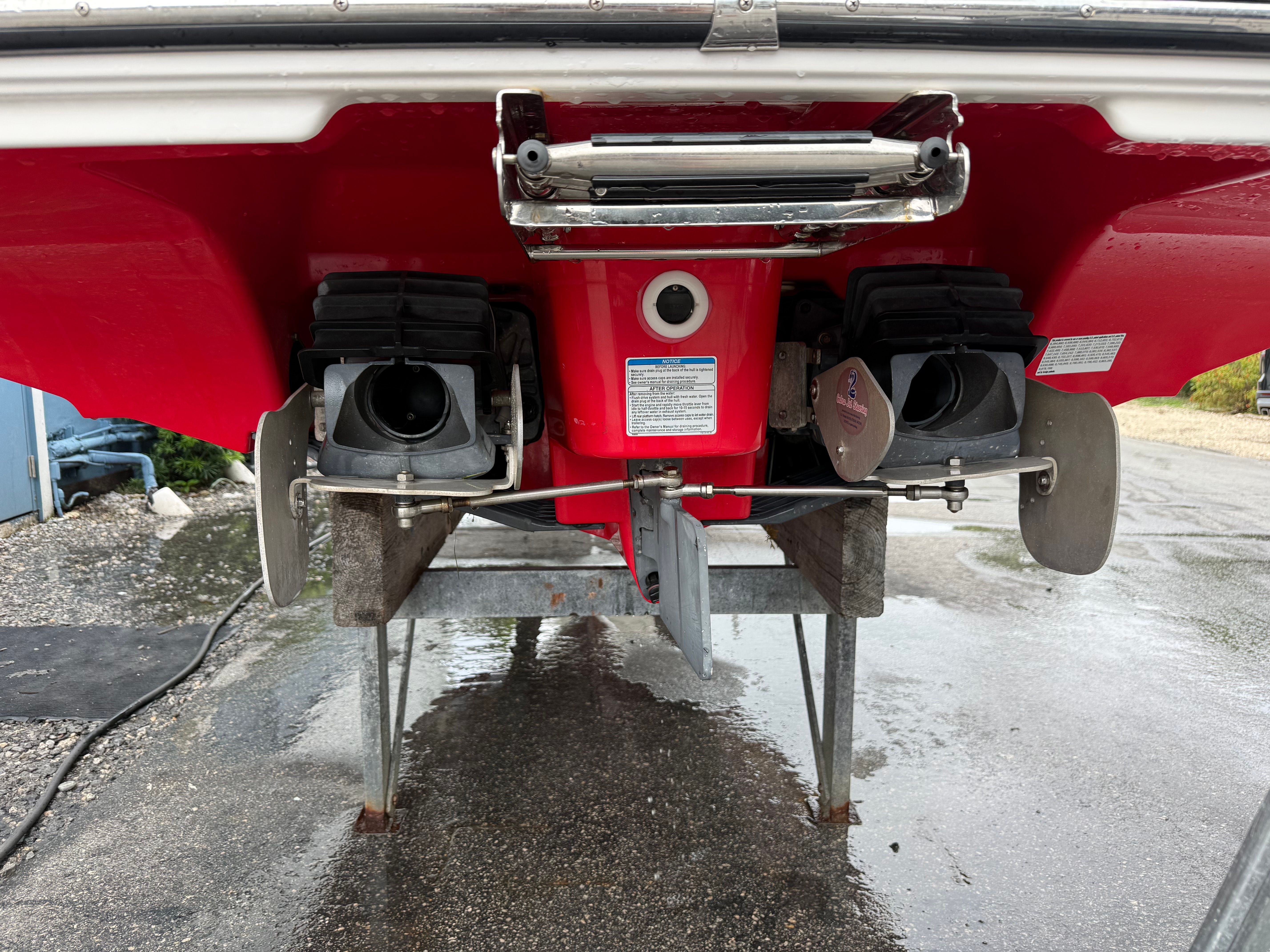 Rear view of a 2020 Yamaha AR242X boat with dual engines.