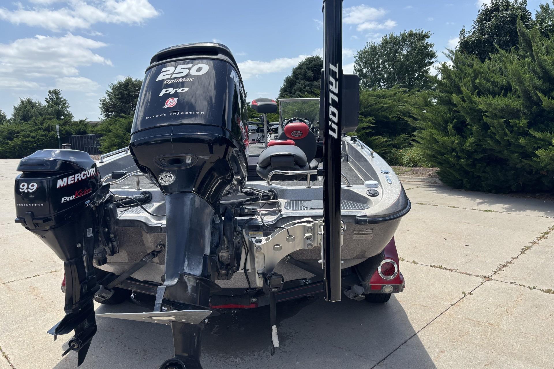 2011 Ranger 620 VS boat with Mercury and OptiMax Pro XS engines, parked outdoors.