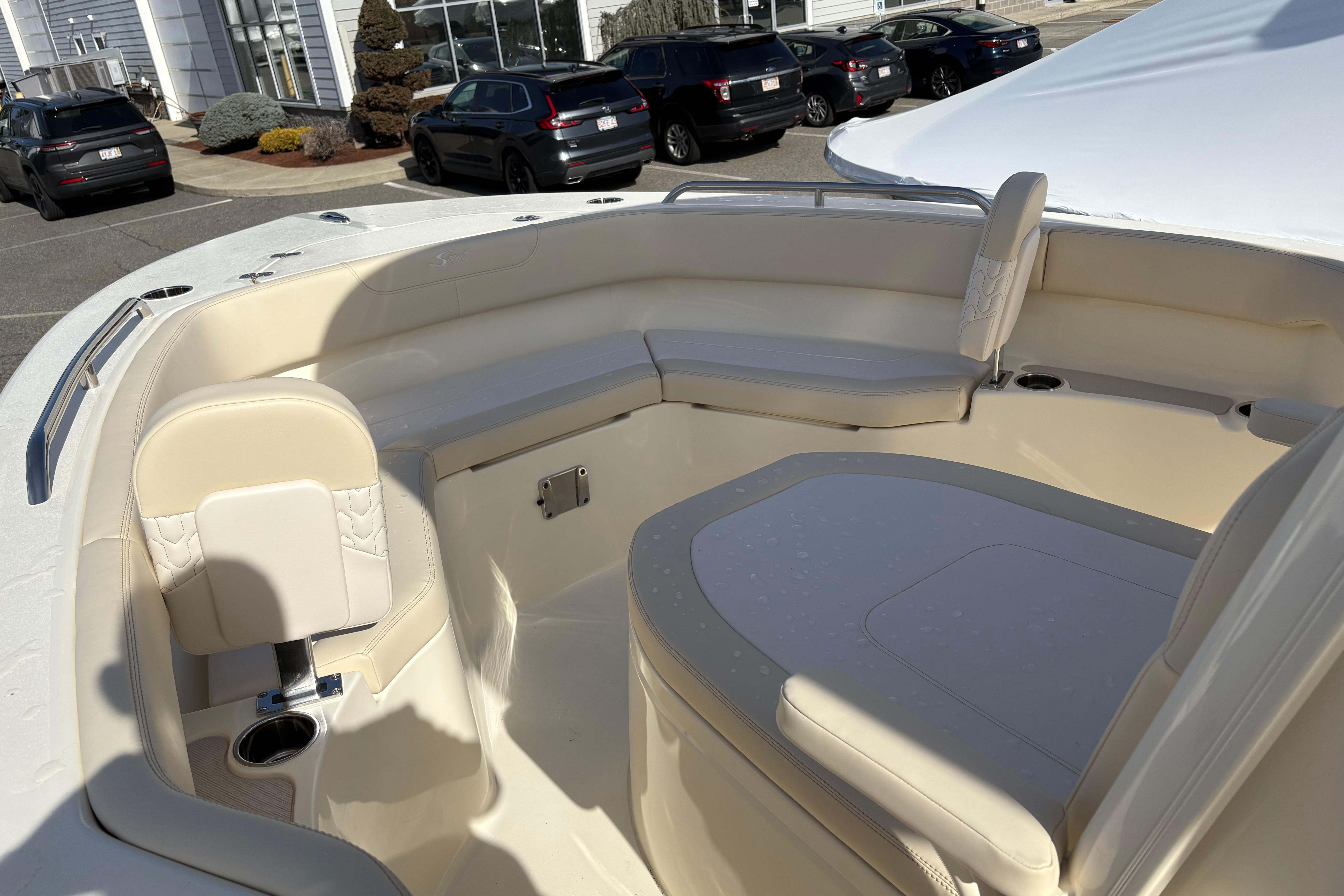 2026 Scout 220 XSF boat interior with beige seating and cup holders.