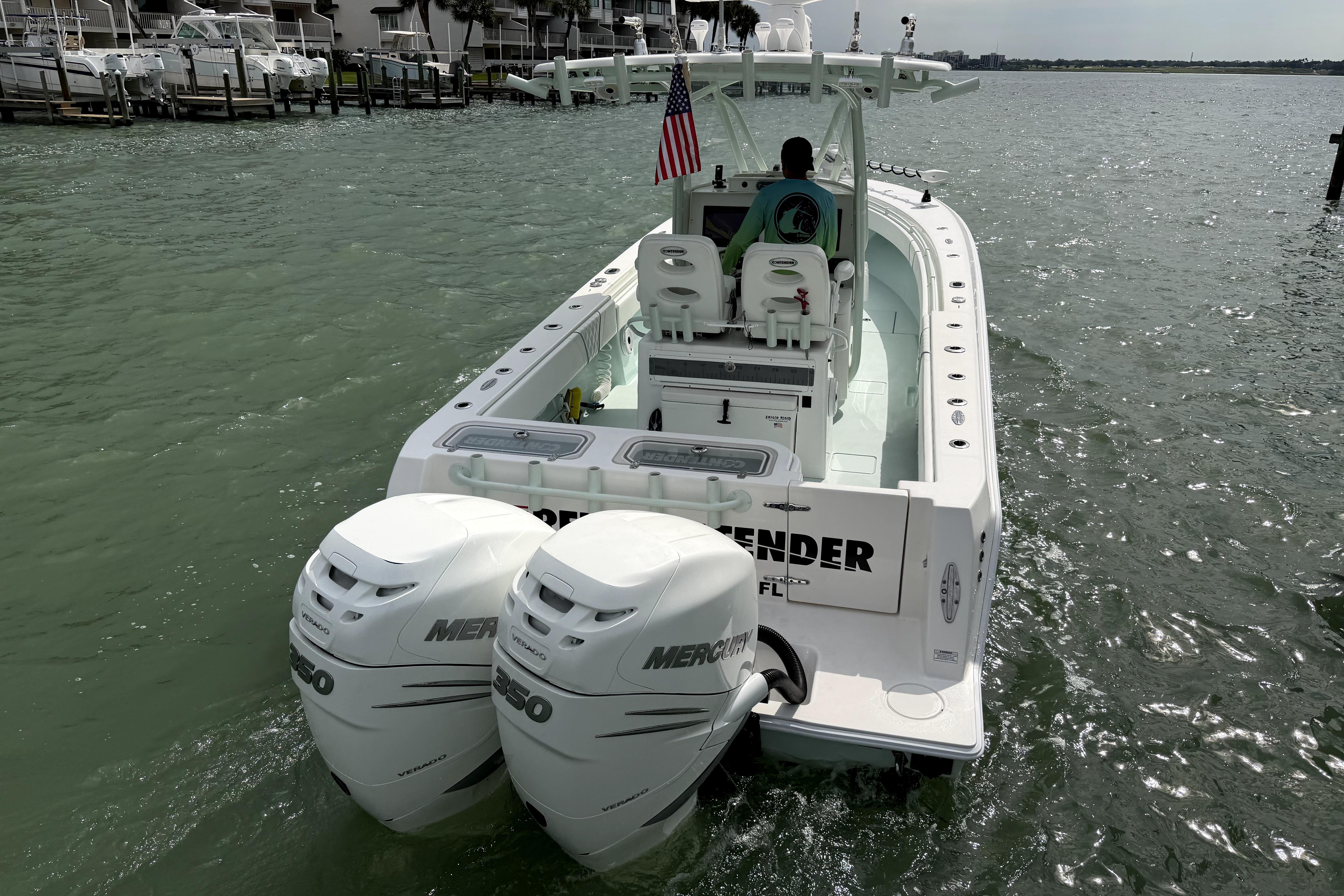 2019 Contender 30 ST boat with dual Mercury engines on the water.