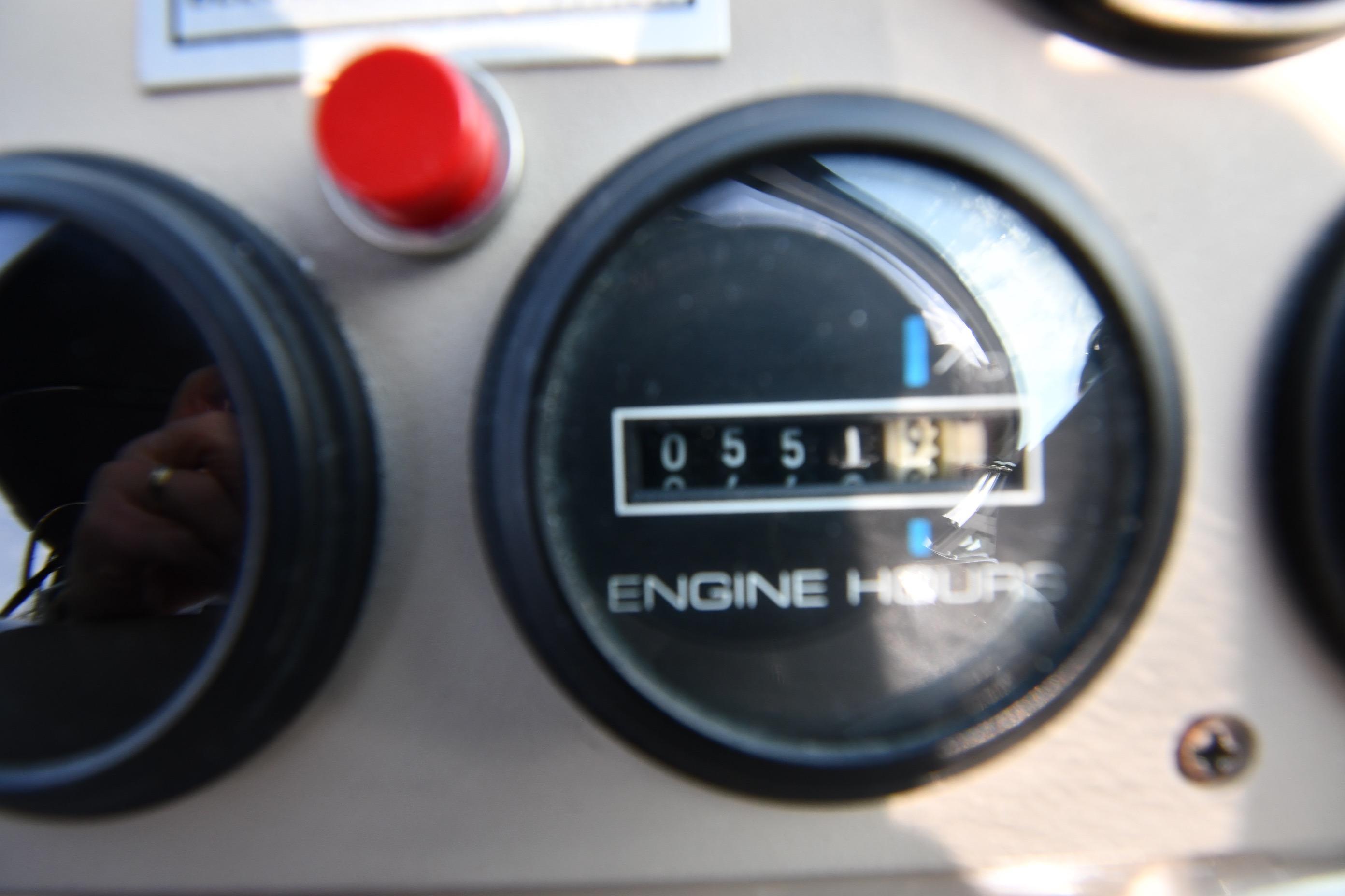 Close-up of Carver 350 Mariner 2000 engine hour meter showing 551 hours.