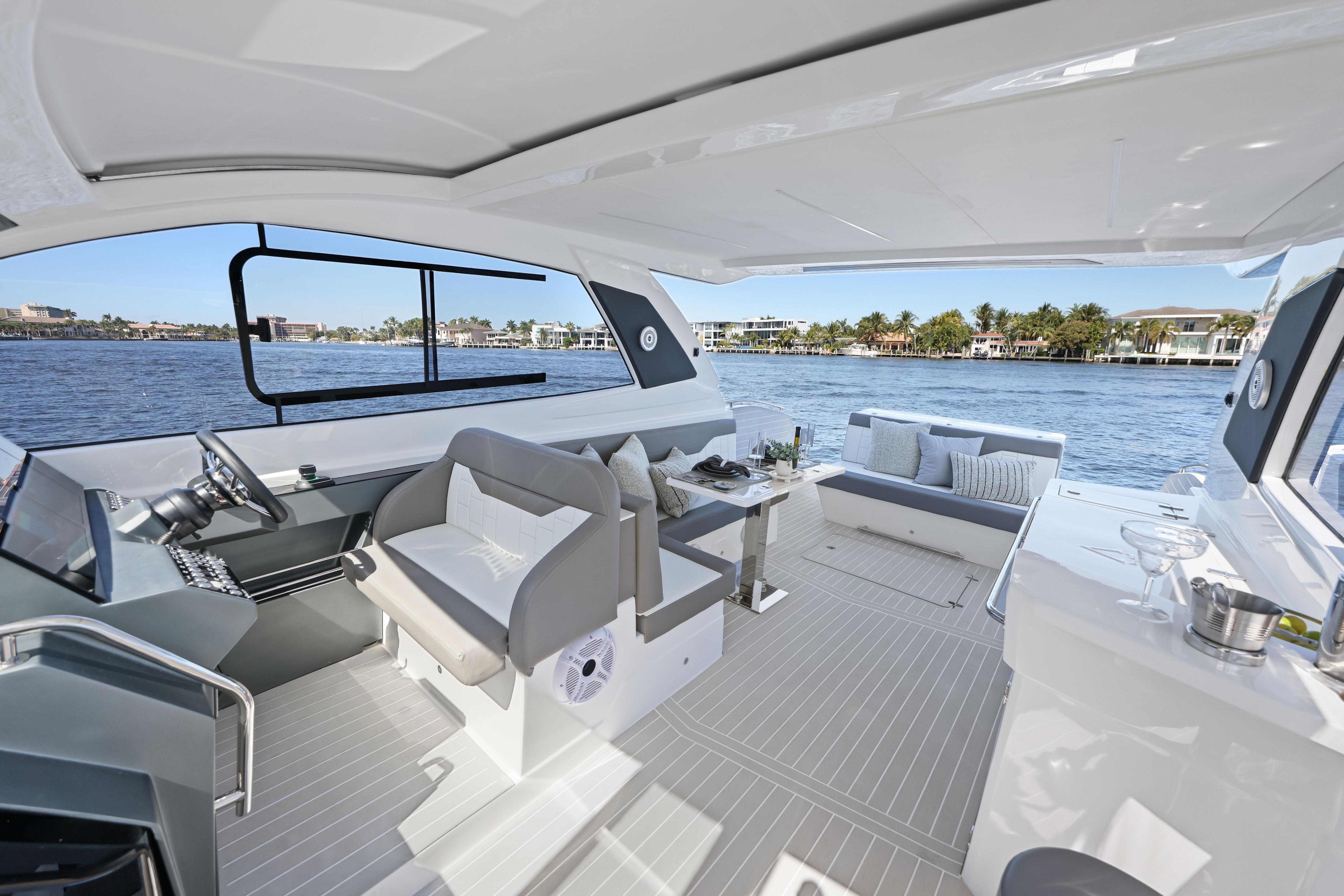 Luxurious 2025 VALIATT YACHTS 380 Bowrider interior with elegant seating and scenic water view.