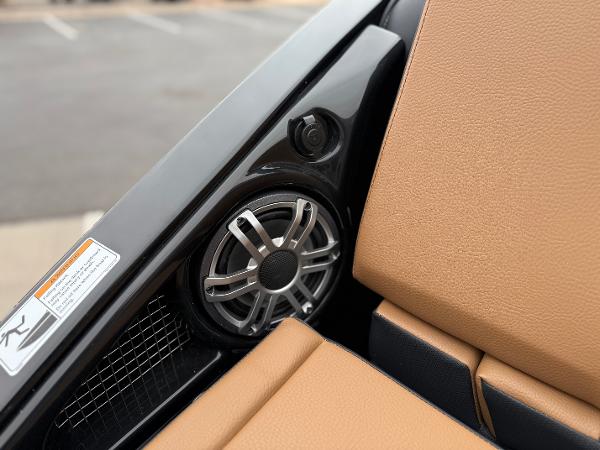 2025 Yamaha Boats 255XD interior speaker and tan seating detail.