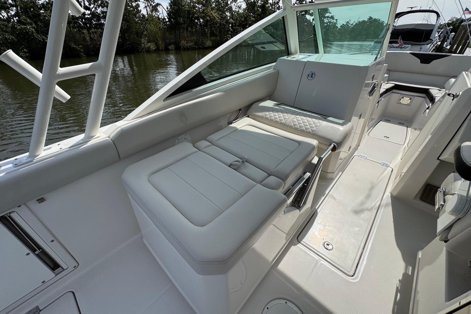 2022 Sailfish 276 DC boat interior with white seating and sleek design.