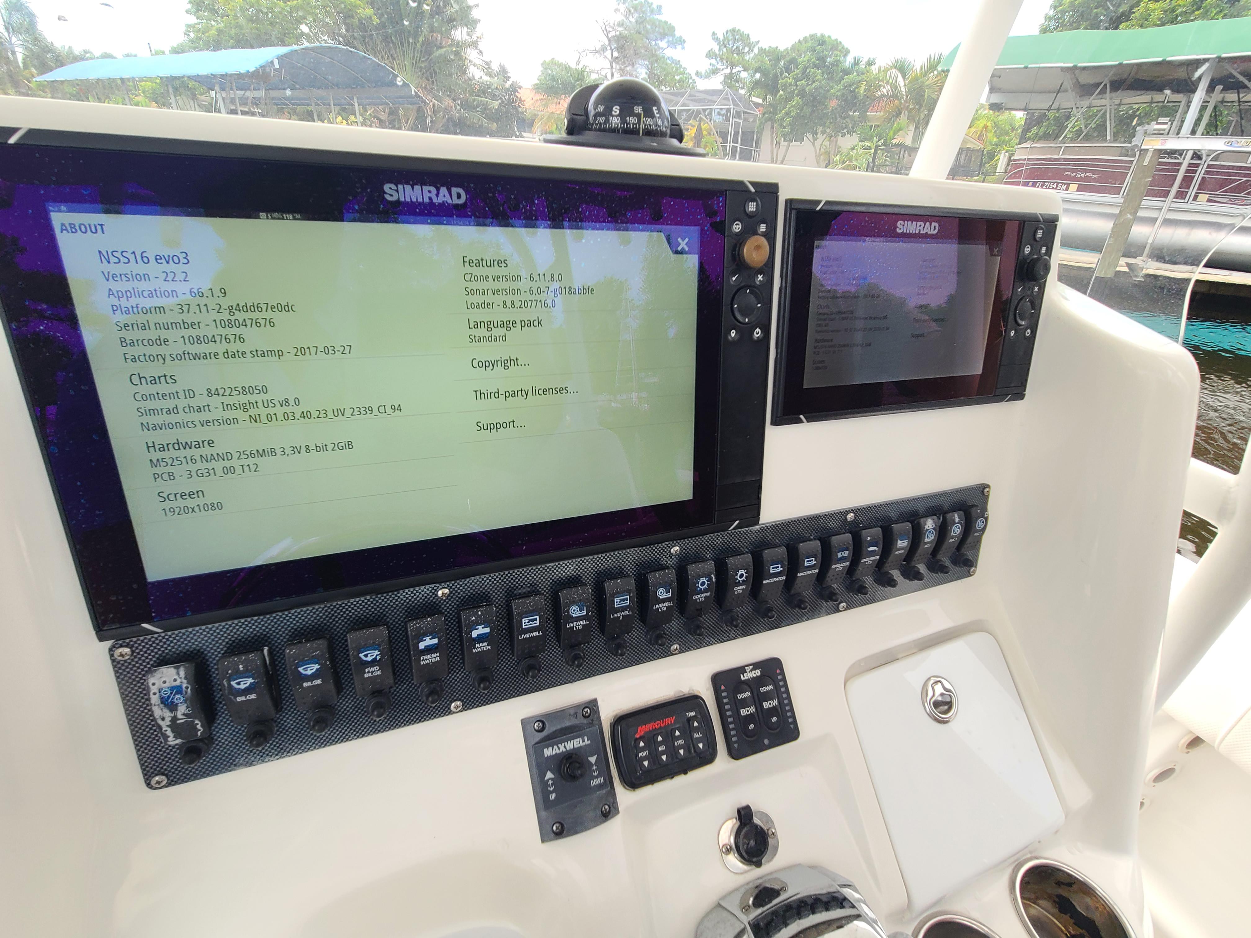 Control panel of a 2009 Glasstream 360 SCX boat with Simrad displays.
