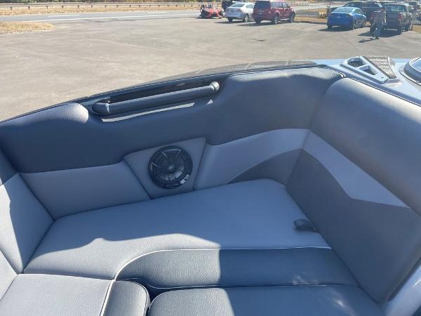 2025 Moomba Mondo boat interior with gray seating and speaker detail.