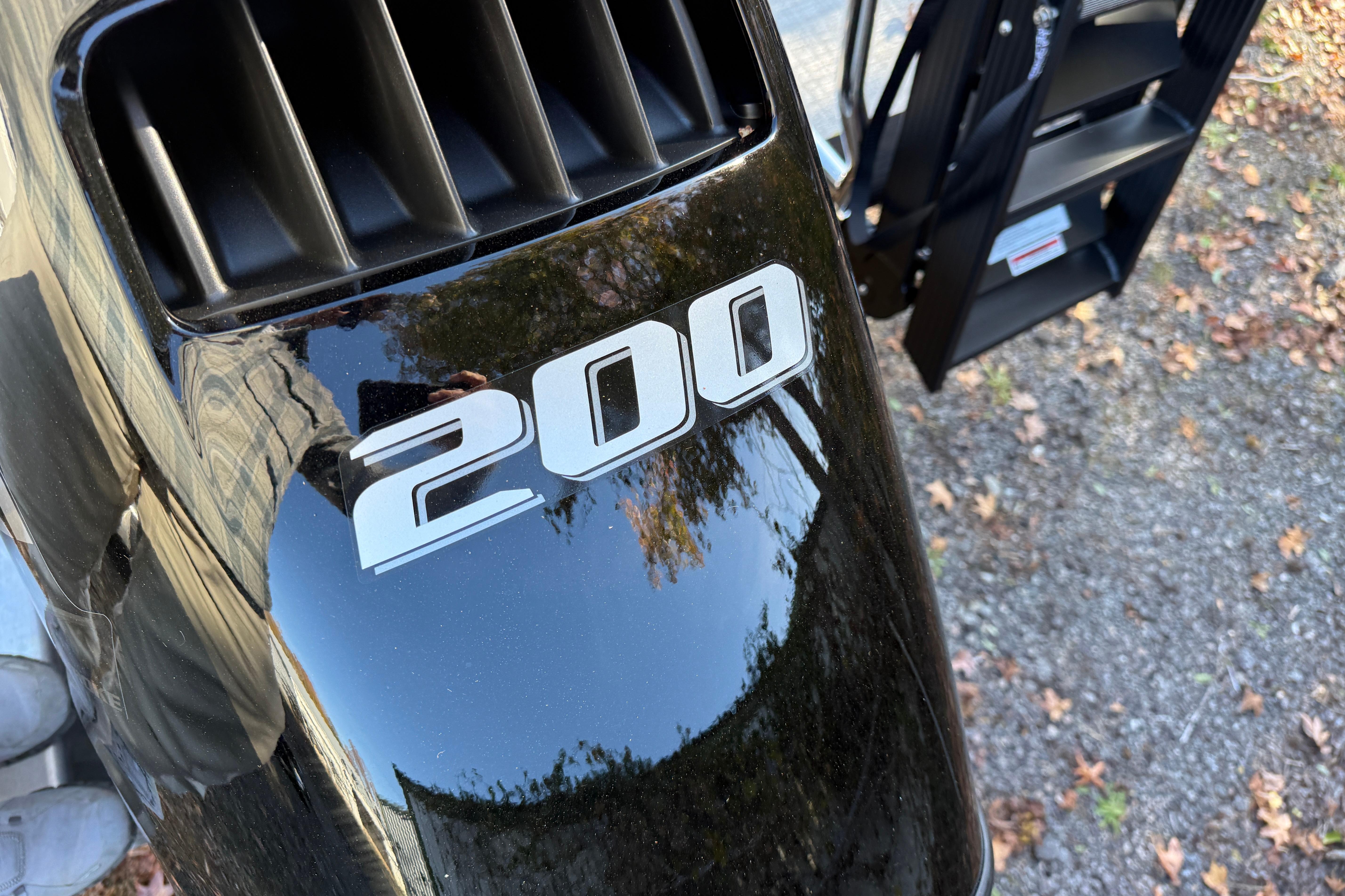 Close-up of a 200 horsepower engine on a 2026 Tahoe Pontoon LTZ Quad Lounger.