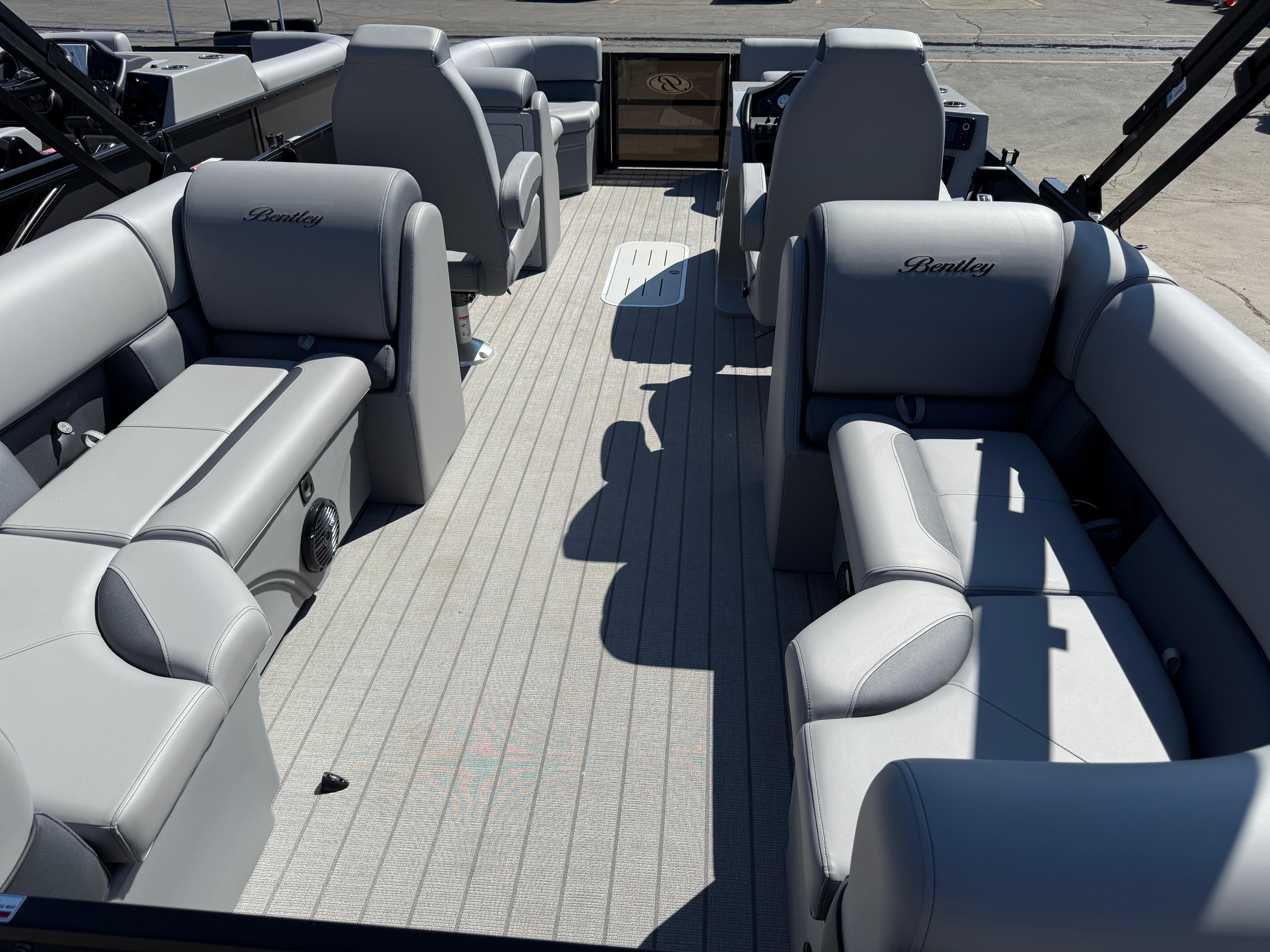2026 Bentley Pontoons Legacy 223 Navigator interior with gray seating and spacious layout.
