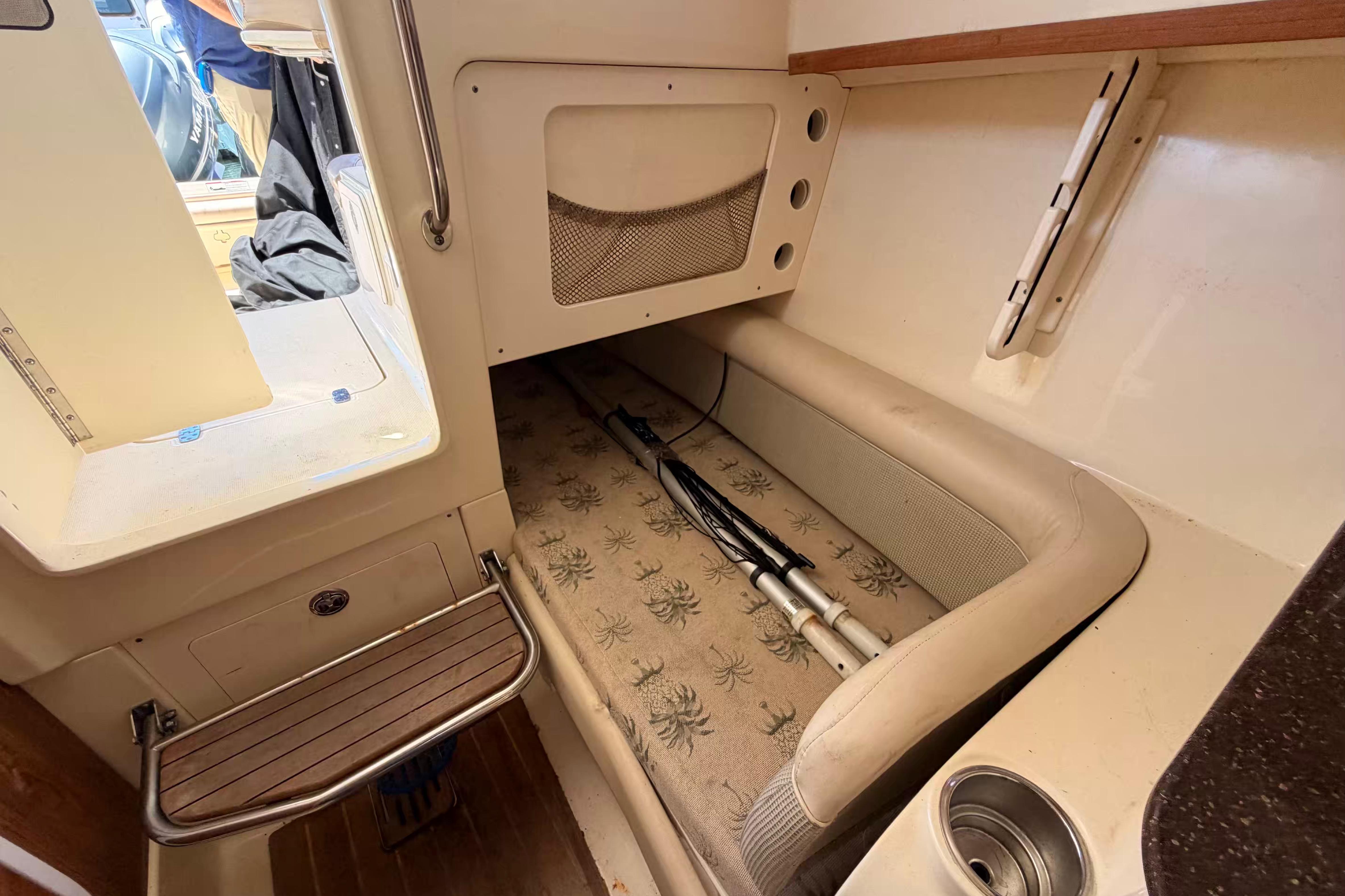Interior cabin of 2007 Scout 262 Abaco boat with seating and storage.
