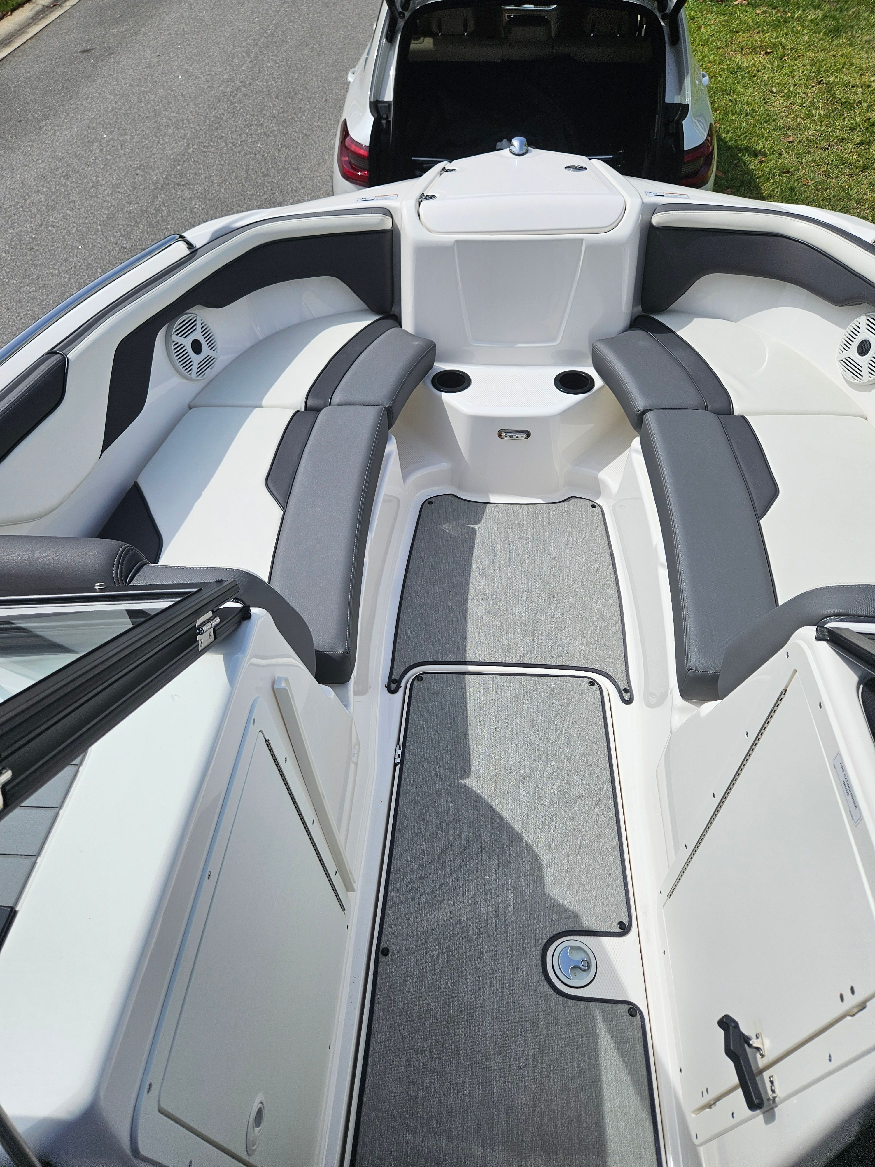 Interior of a 2022 Yamaha SX210 boat with gray seating.