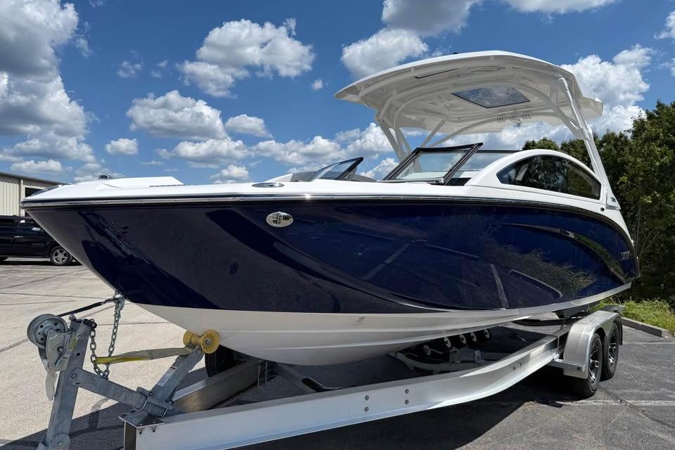 2026 Yamaha Boats 275SD on trailer under blue sky with clouds.