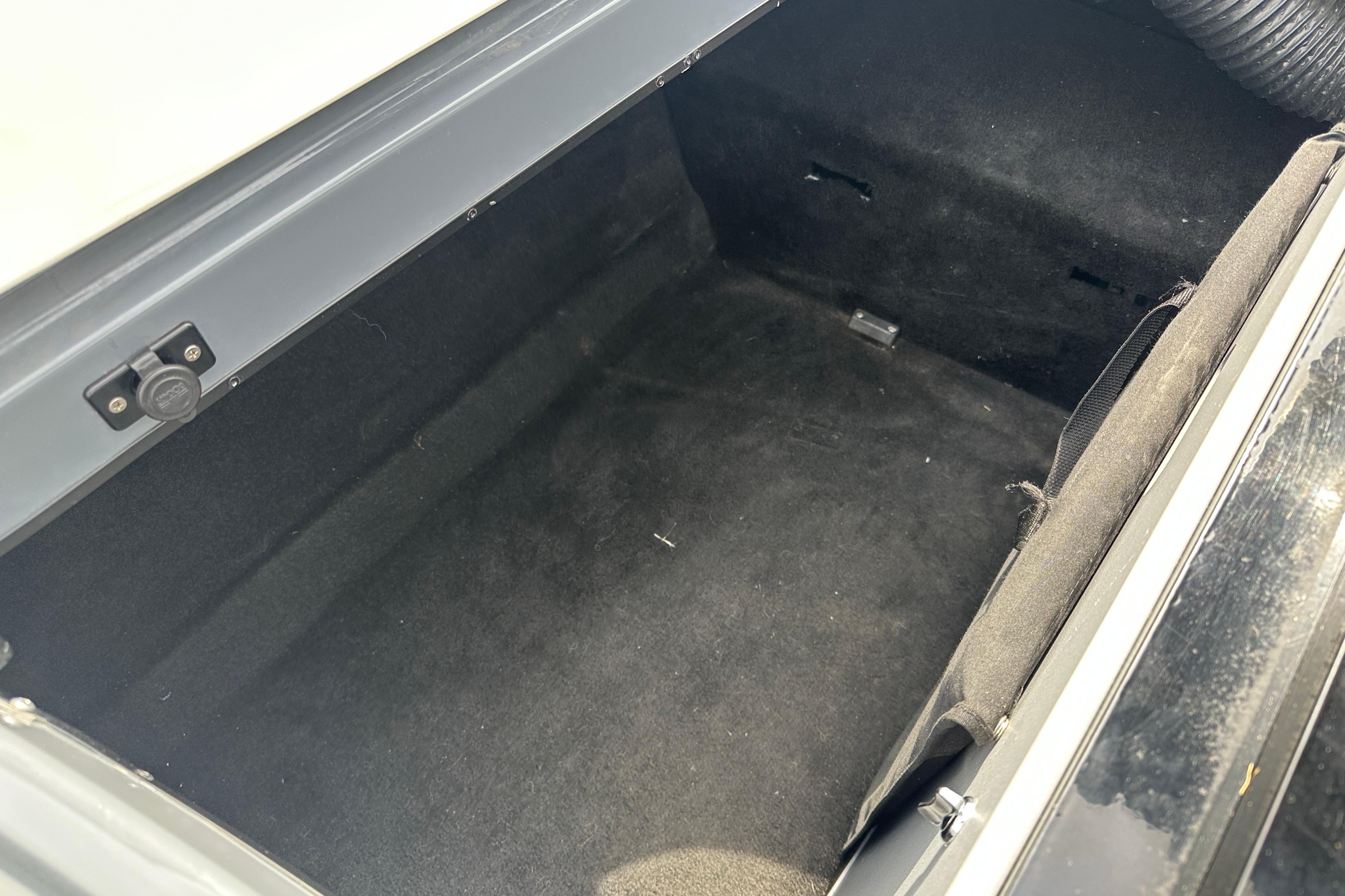 Open storage compartment of 2008 Centurion Enzo SV240 boat, showing interior space.