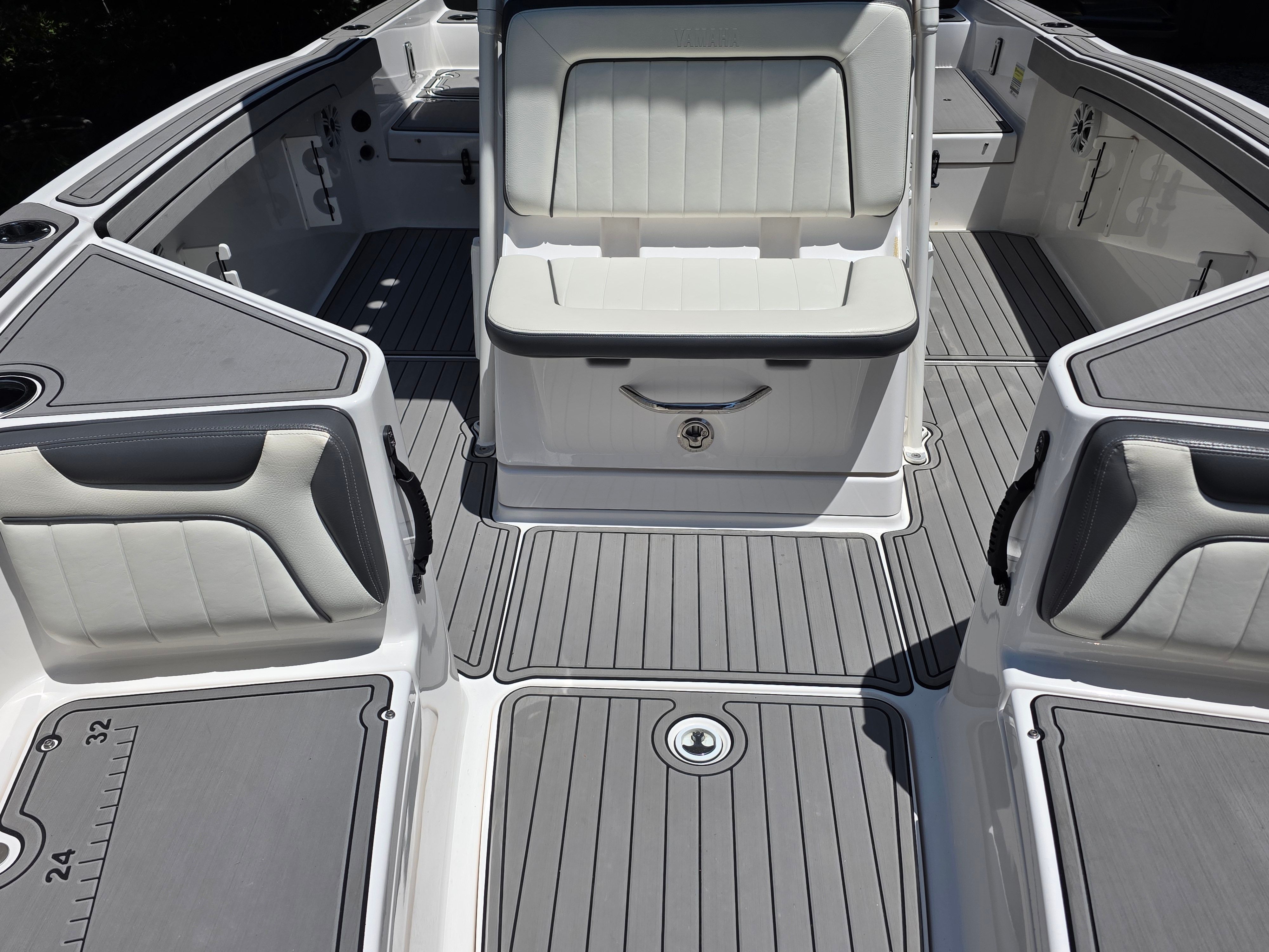 Interior of a 2020 Yamaha 210 FSH Sport boat with gray seating.