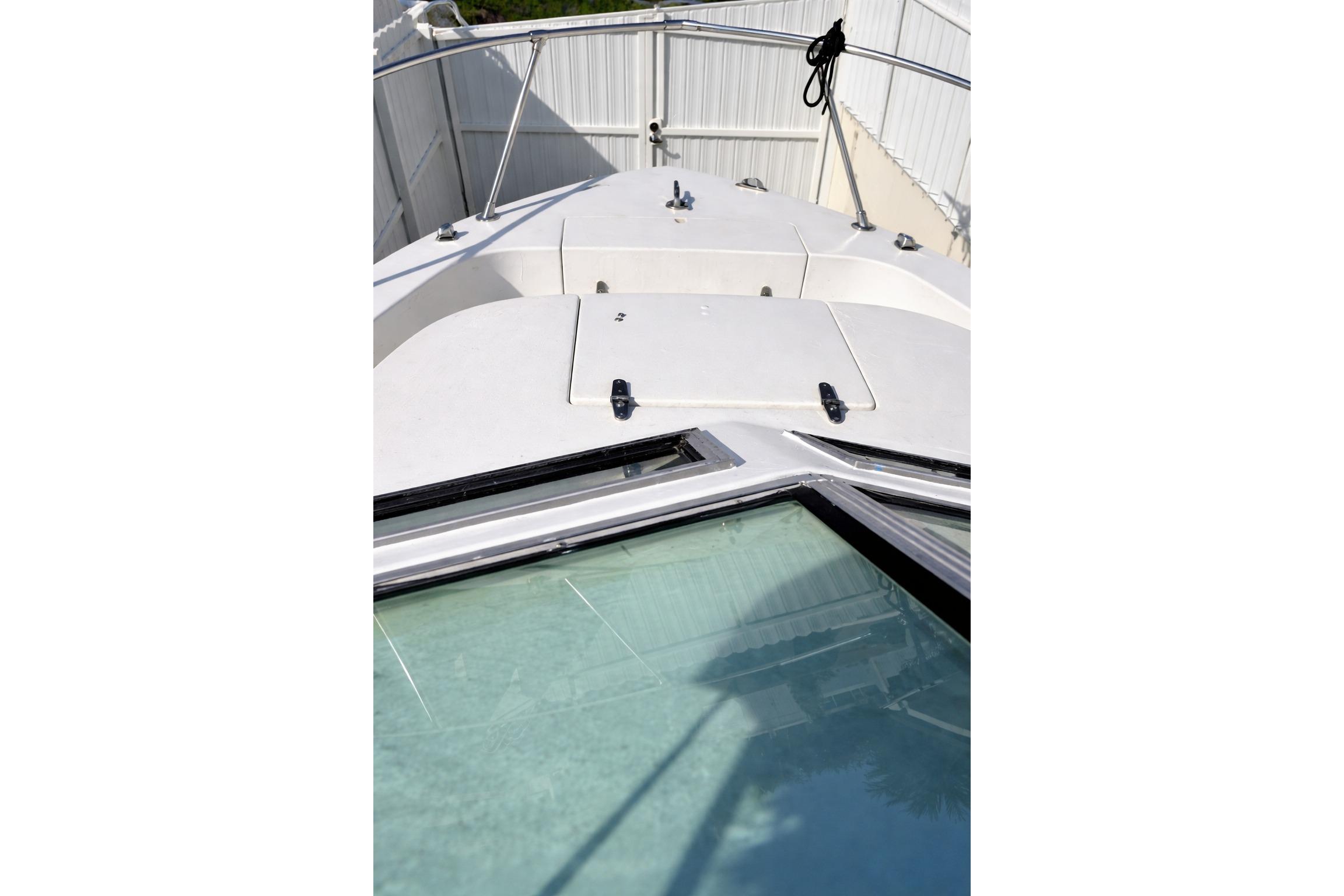 1989 Grady-White Offshore 242 boat deck with railing and hatch.