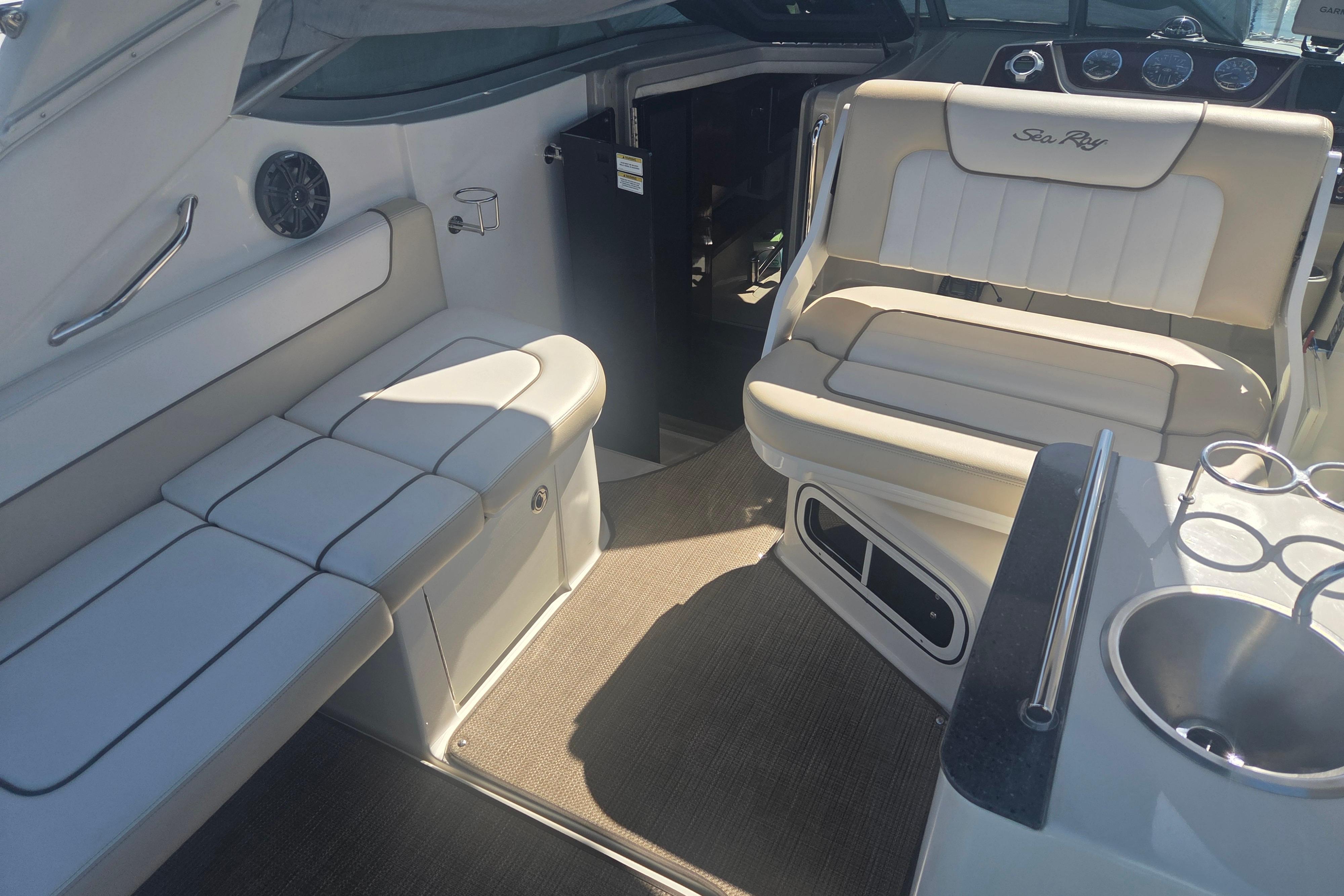 Interior of 2012 Sea Ray Sundancer 260 boat with seating and sink.