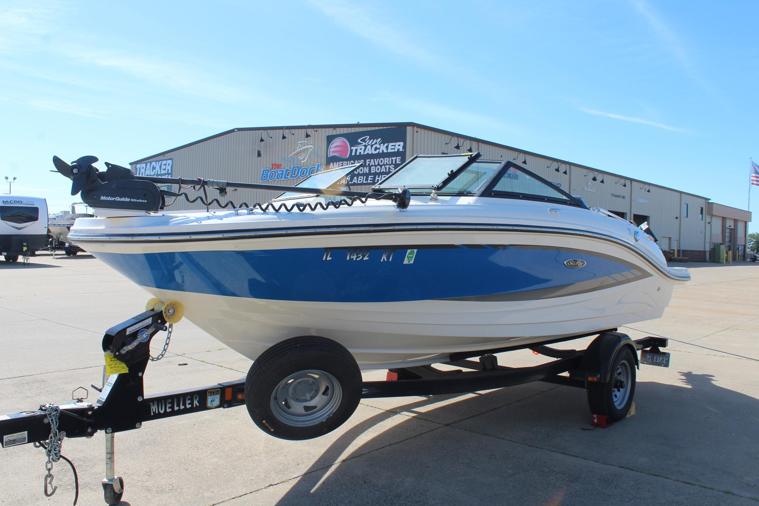 2015 Sea Ray 19 SPX OB boat on trailer, parked outside dealership.
