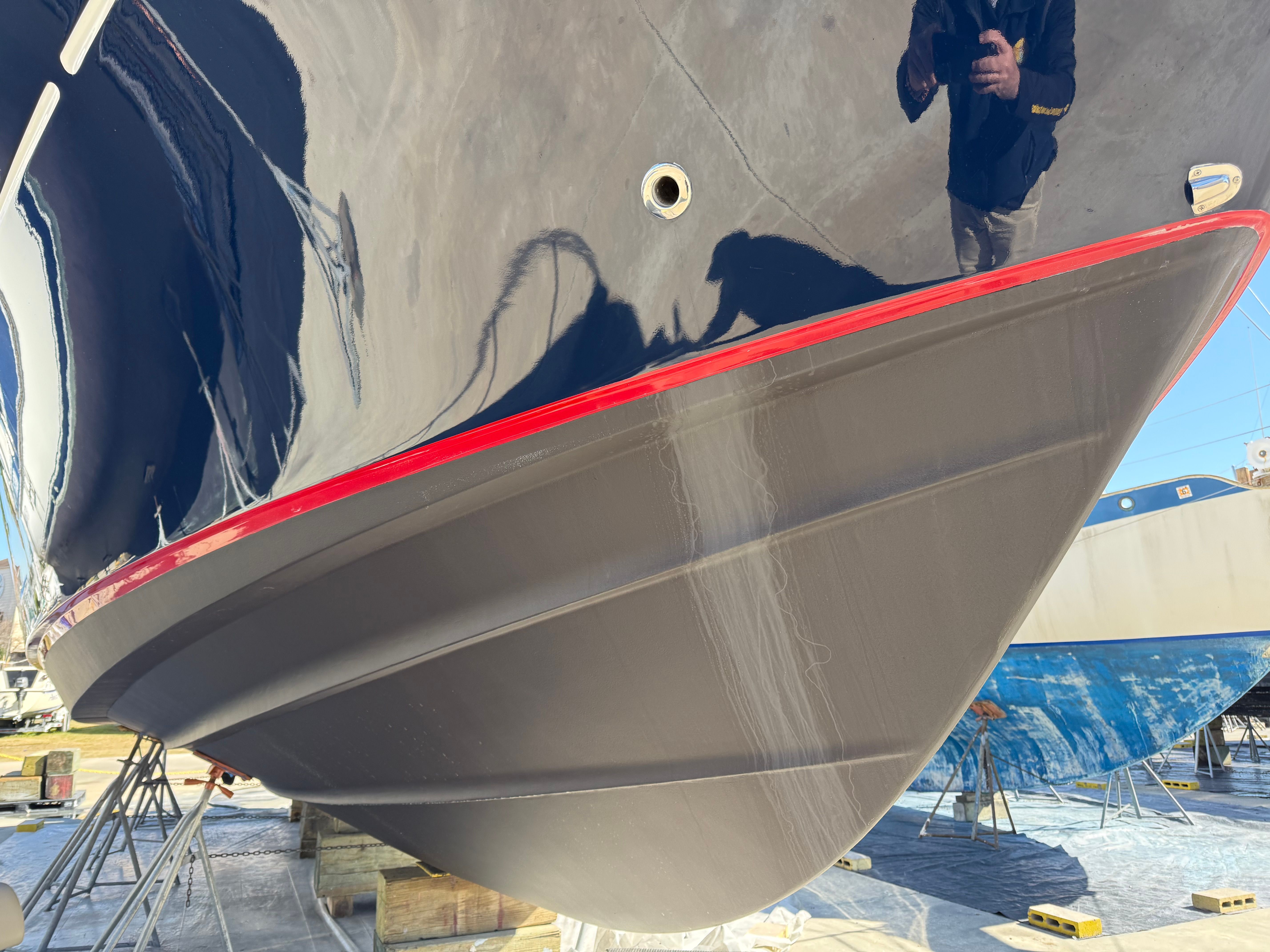 Close-up of a 2007 Chris-Craft Roamer 40 hull in a dry dock setting.