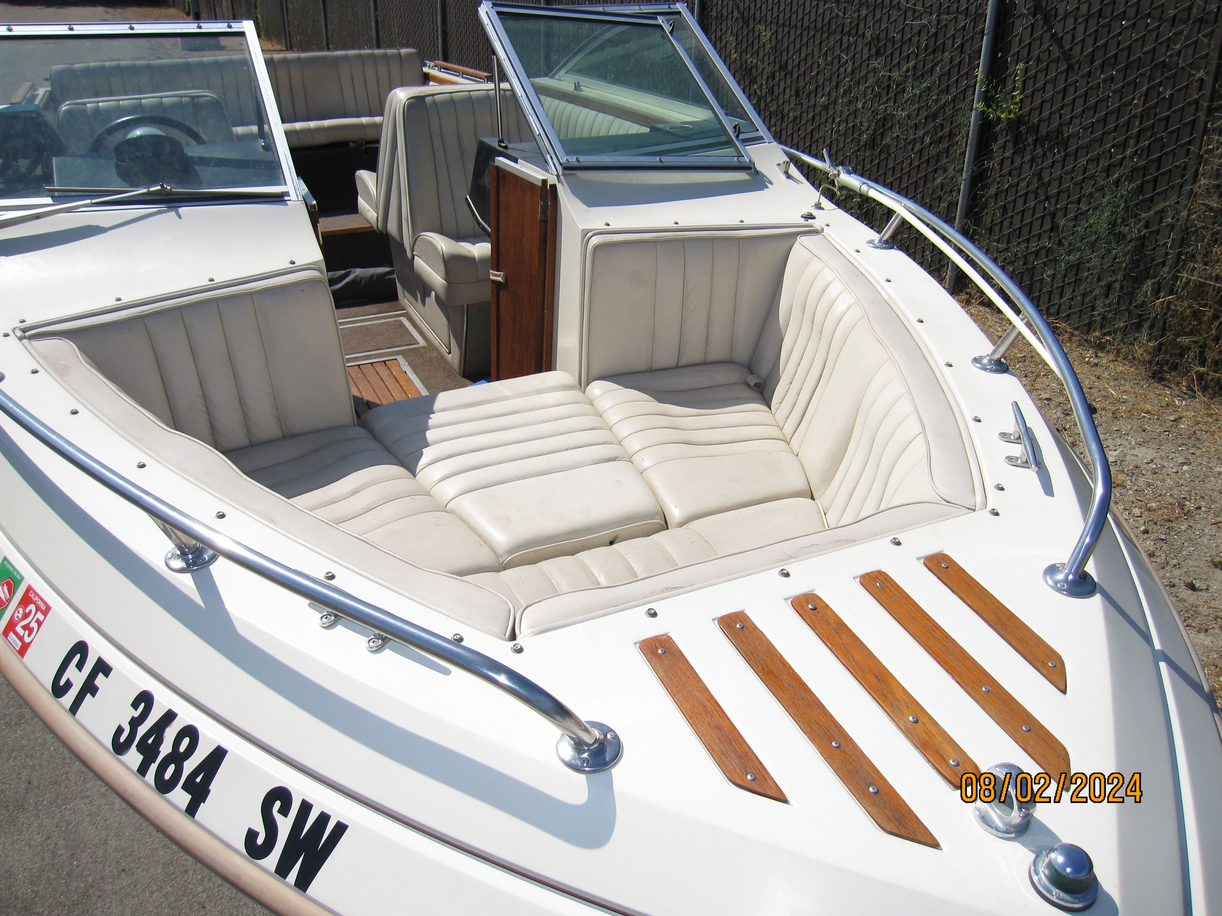 1990 Cobalt Bowrider Classic with beige interior and wood accents.