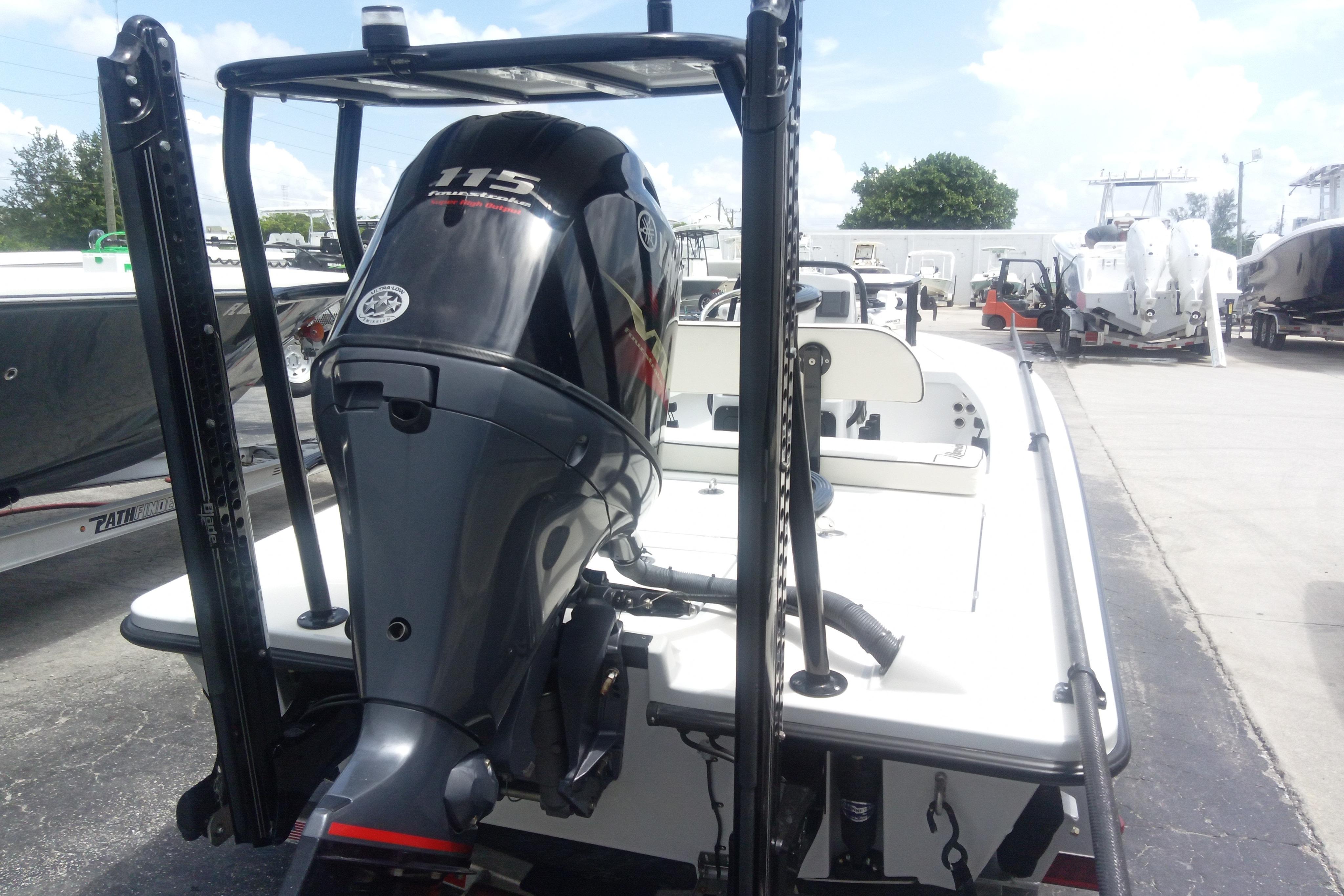 2020 Maverick 18 HPX-V boat with Yamaha 115 outboard motor, parked outdoors.