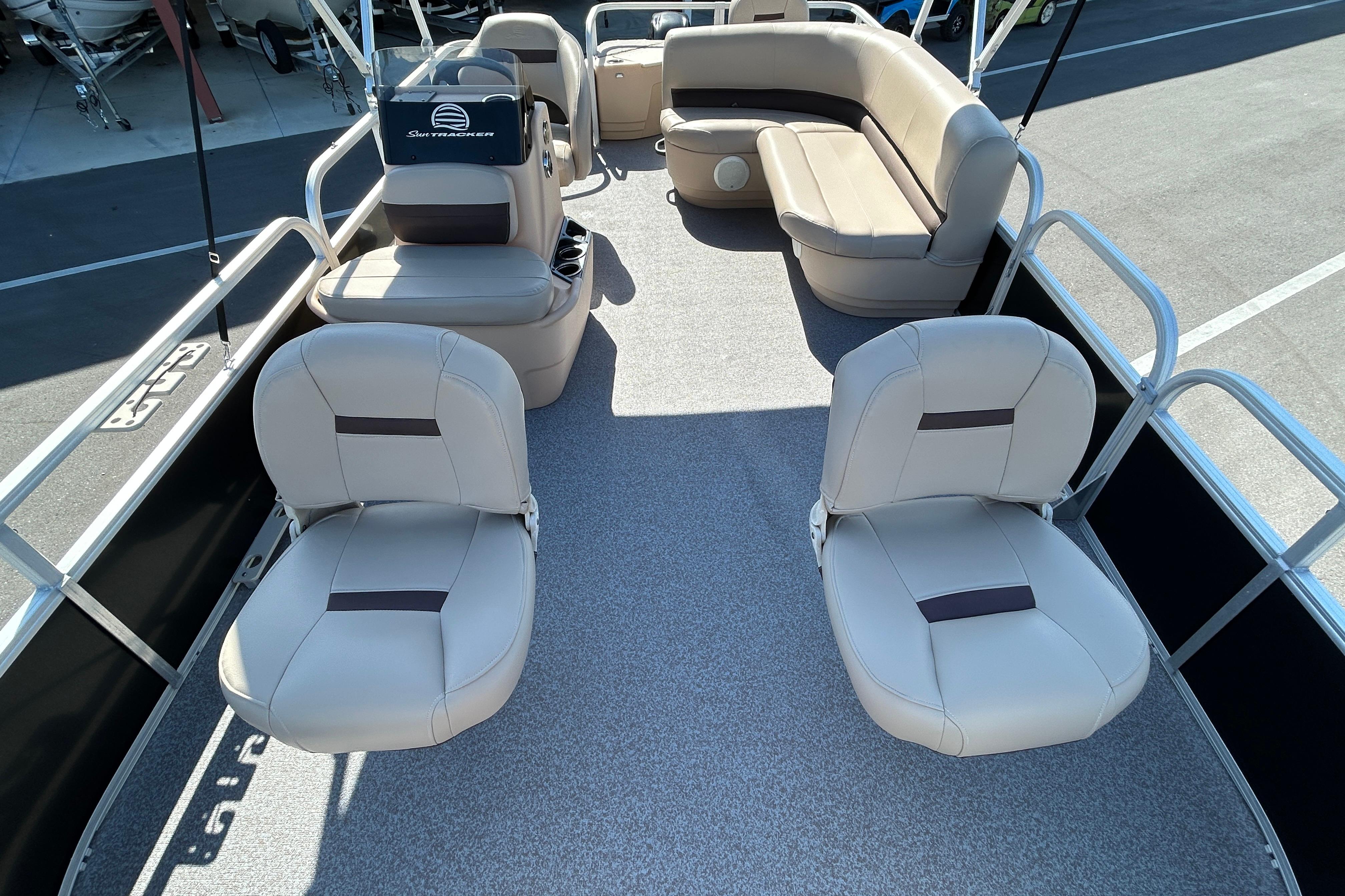 2017 Sun Tracker Bass Buggy 18 DLX pontoon boat interior with seating and helm.